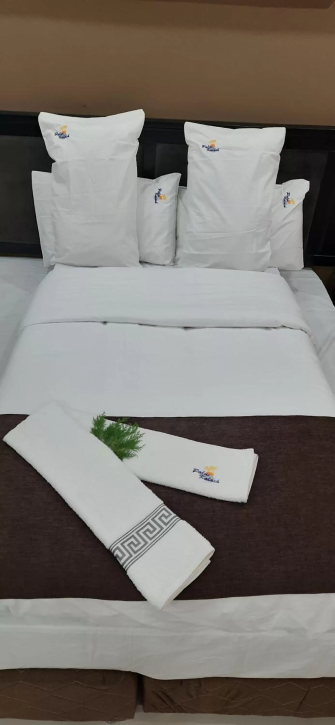Bed in Palm Kalash Hotel