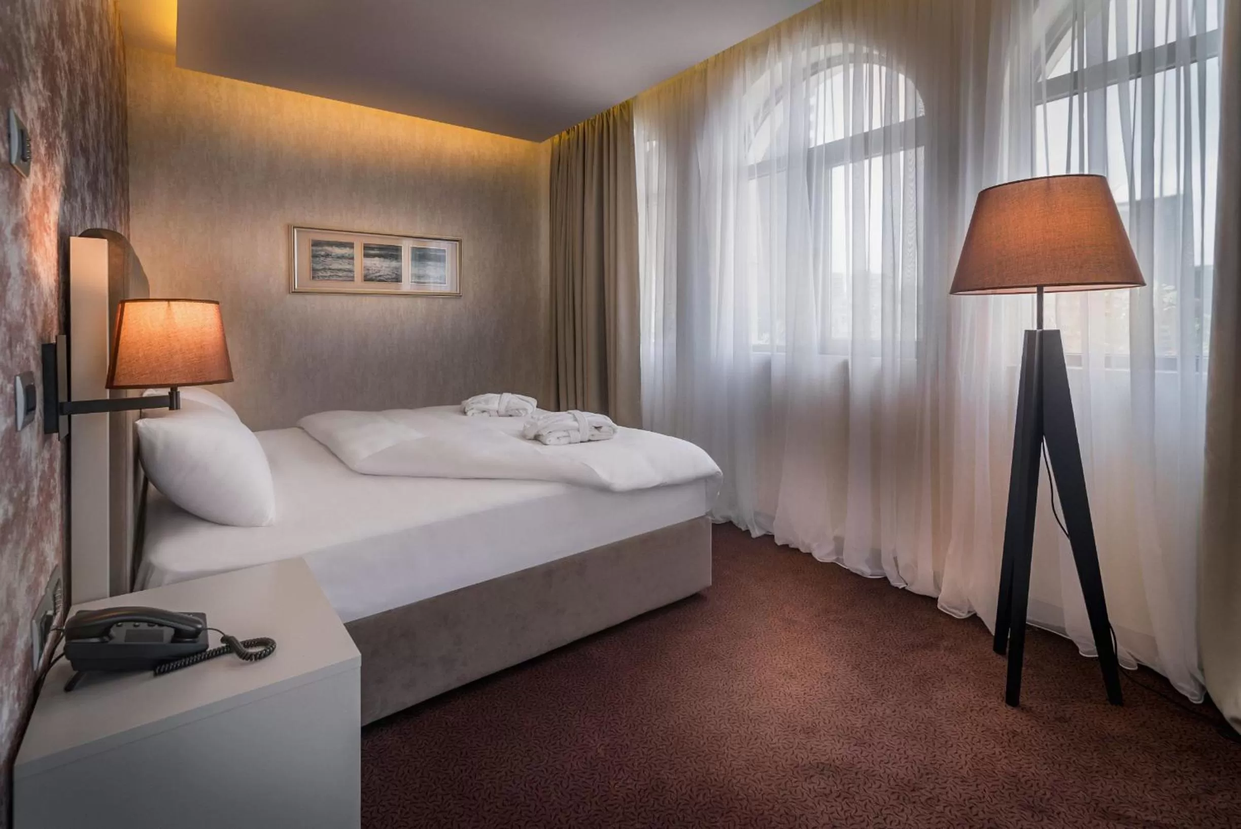 Bed in The Grand Gloria Hotel