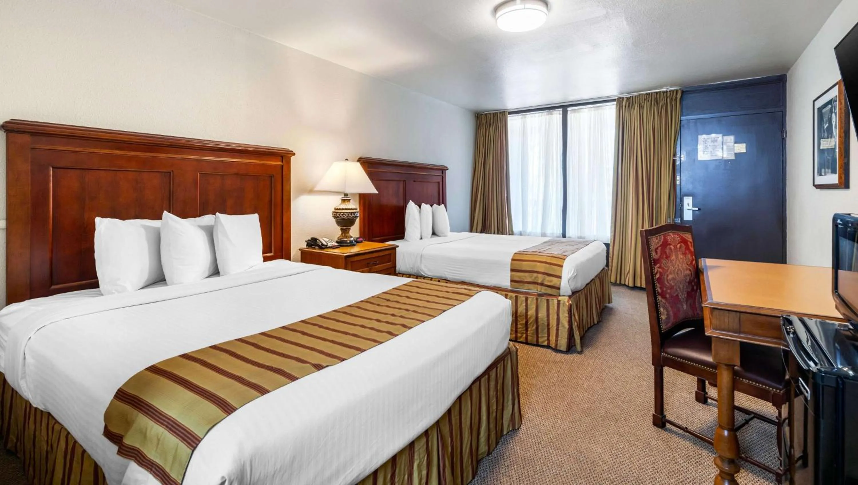 Photo of the whole room, Bed in Magnuson Grand Hotel and Conference Center Tyler