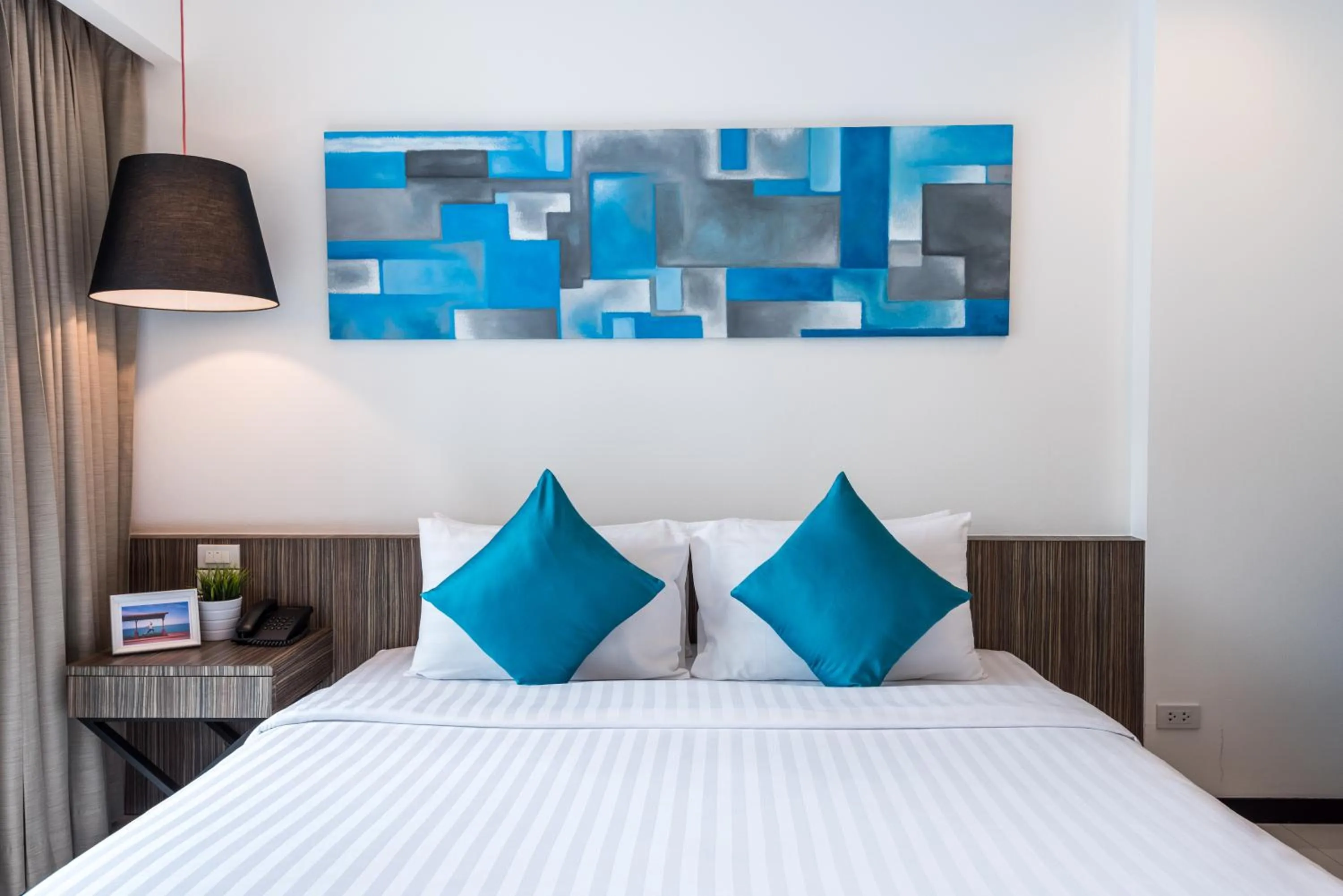 Bed in Hotel J Residence Pattaya