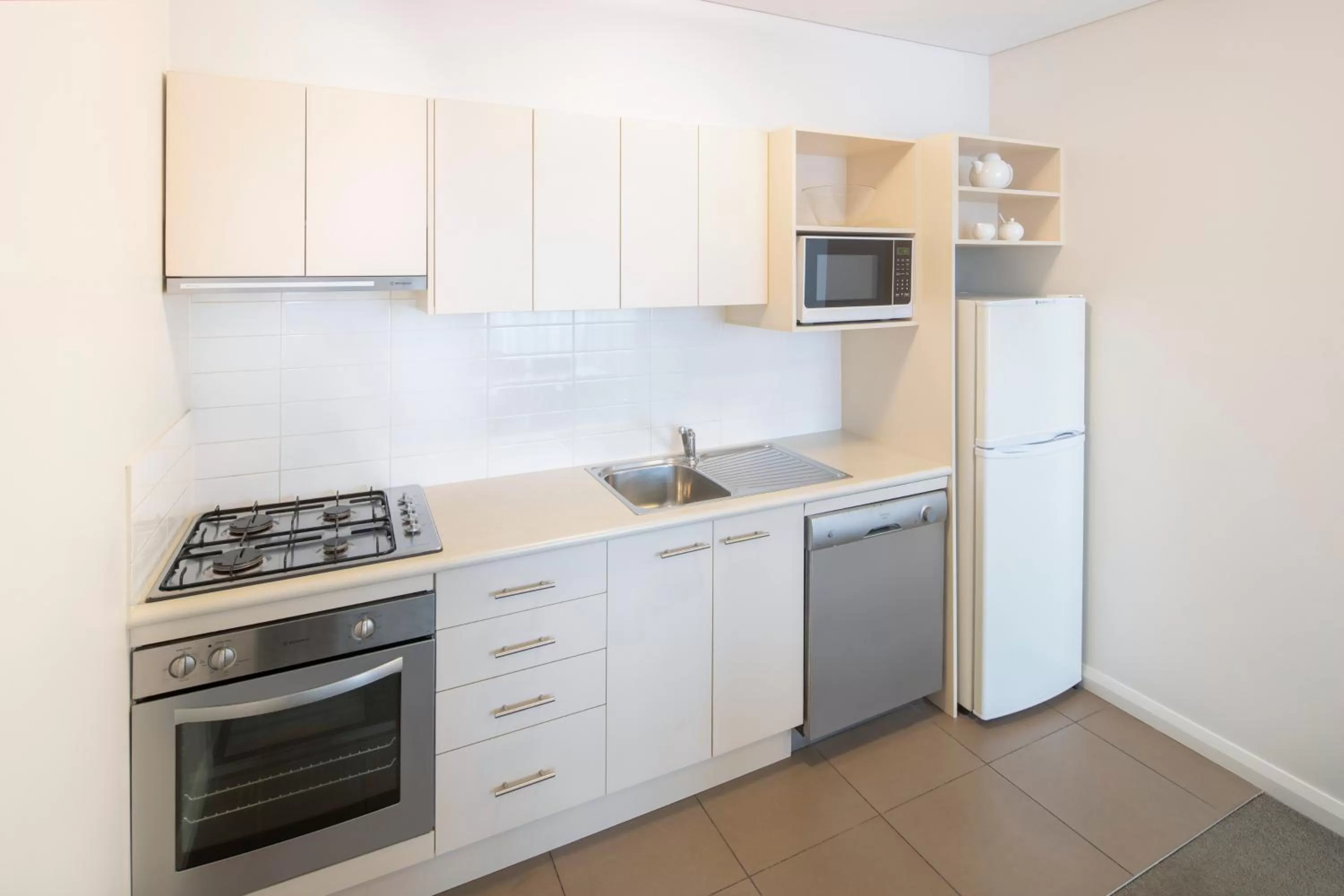 Kitchen or kitchenette in Mantra Castle Hill Sydney, an Accor Hotel