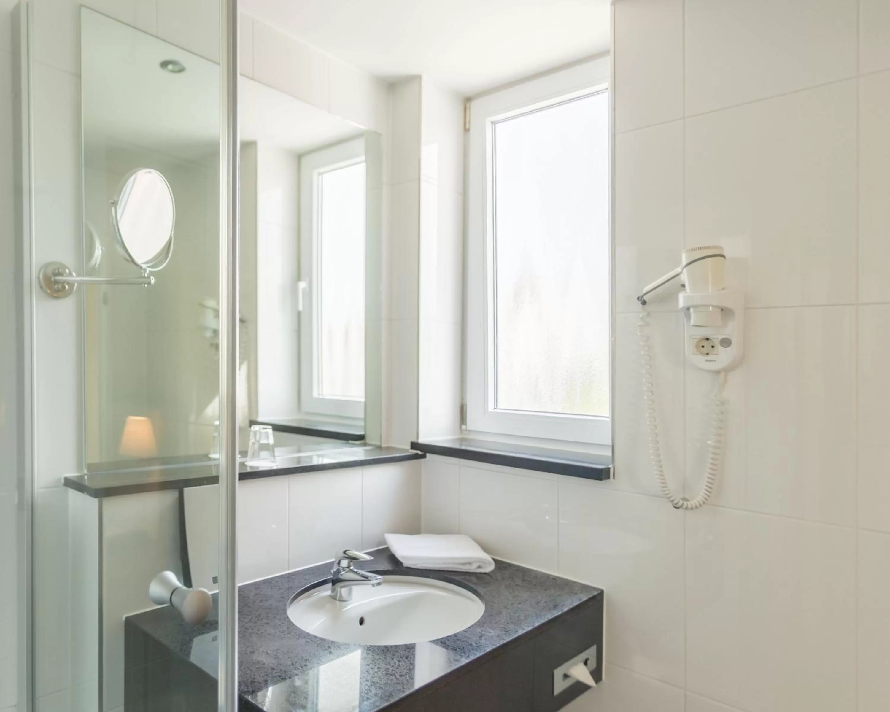 Bathroom in Ramada by Wyndham München Airport