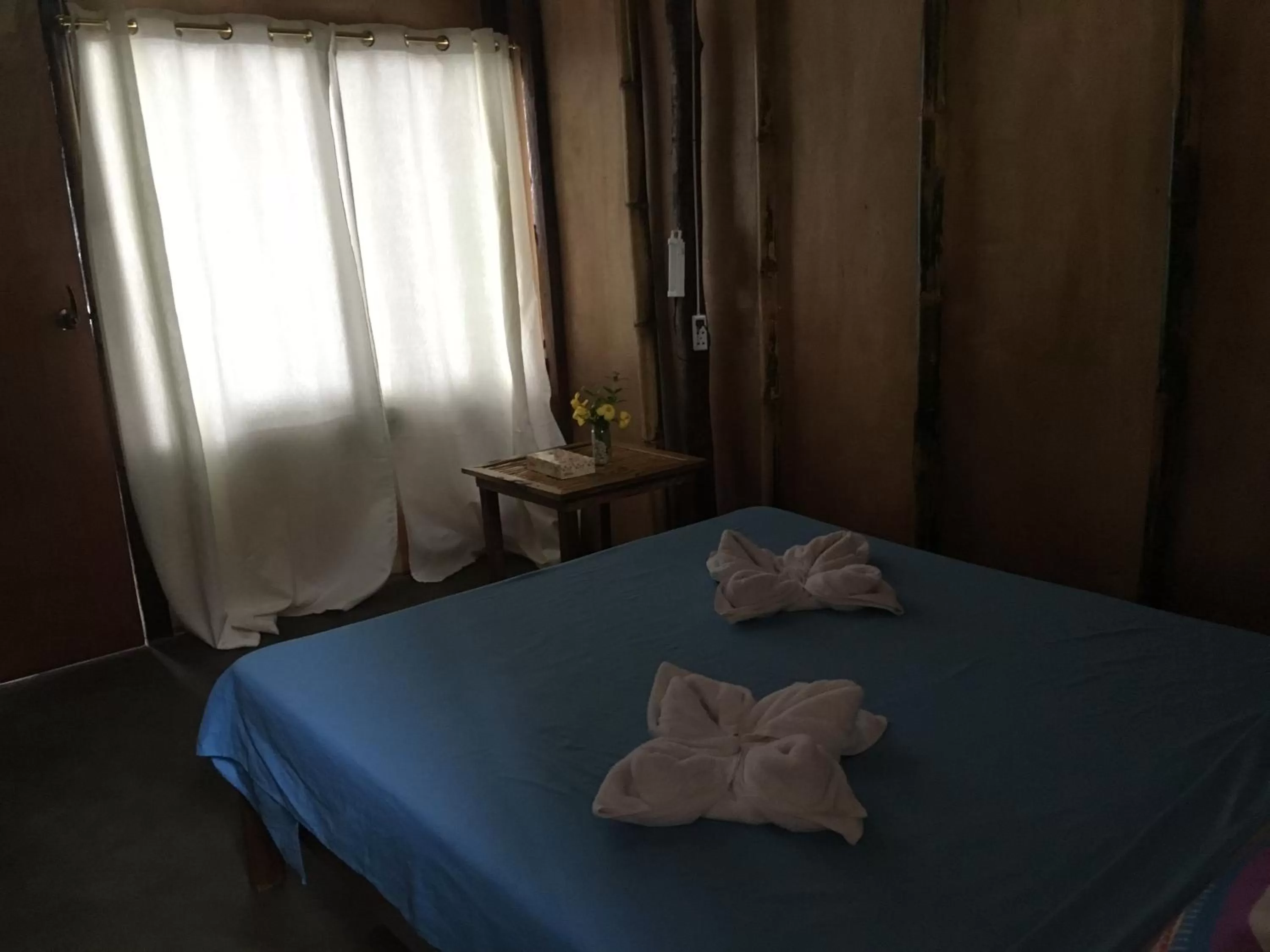 Bed in Prince John Beachfront Eco Bungalows and Restaurant