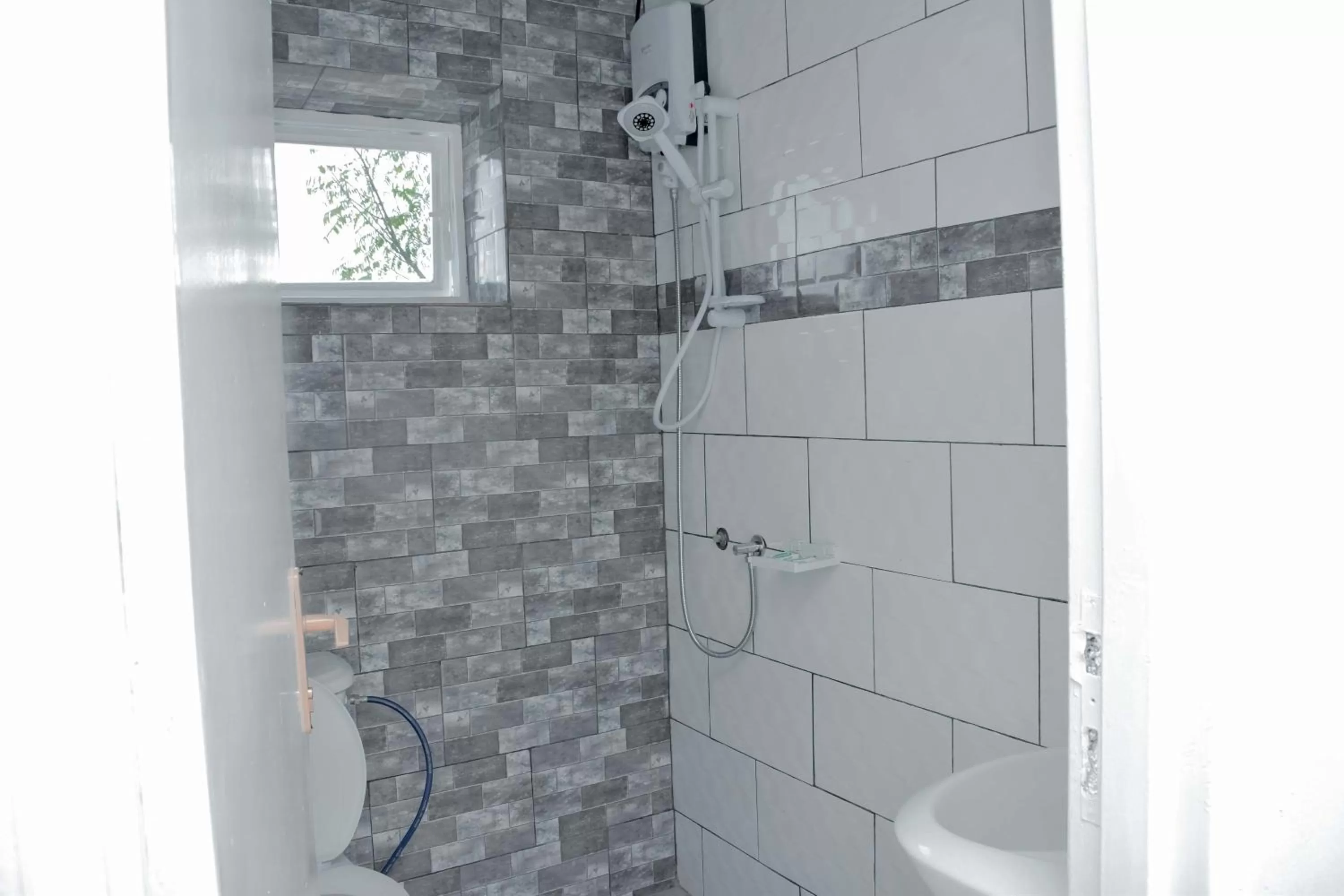 Shower in INZOZI AFRICA HOUSE B&B-Gishushu