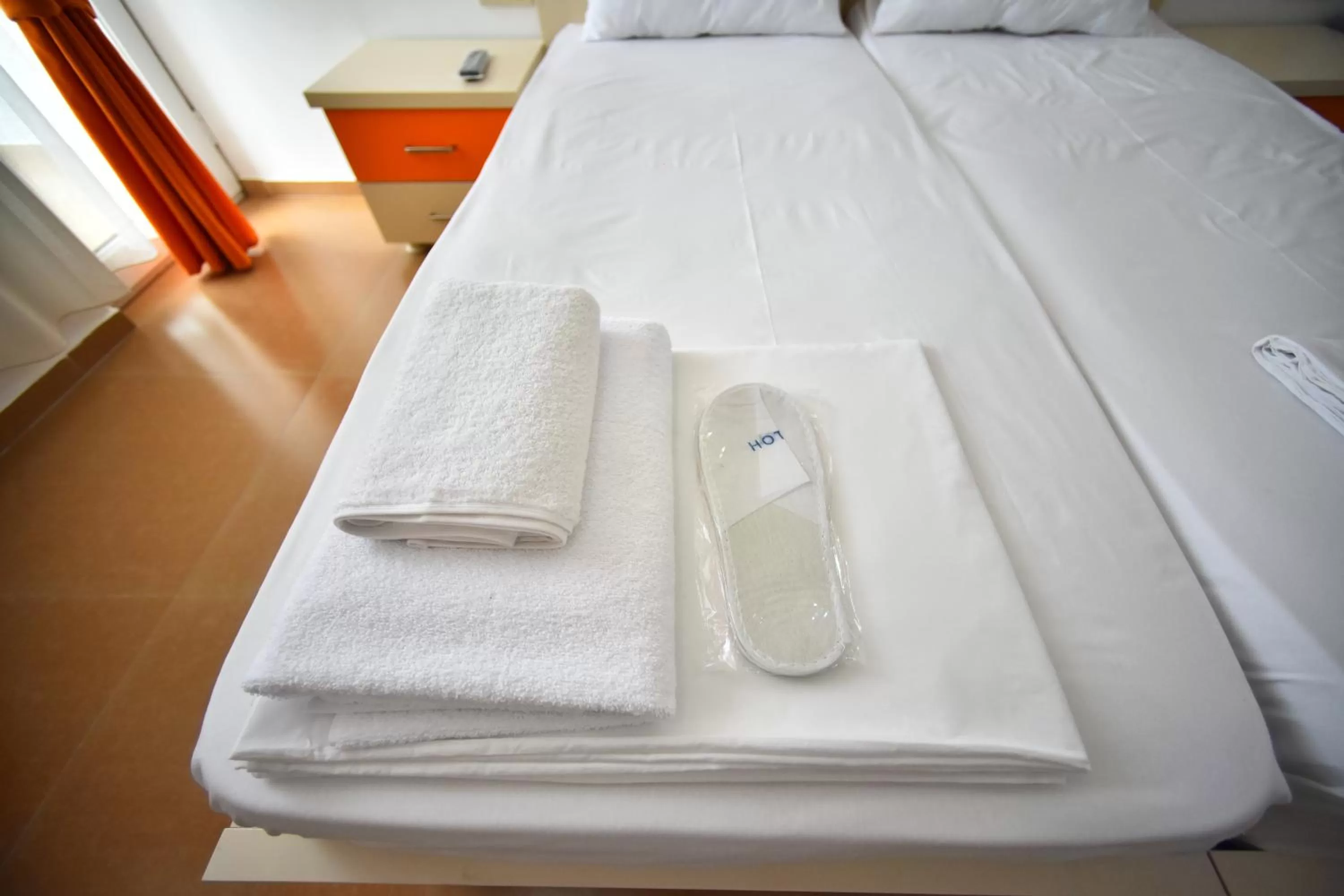 Bed in Orange Home Hotel