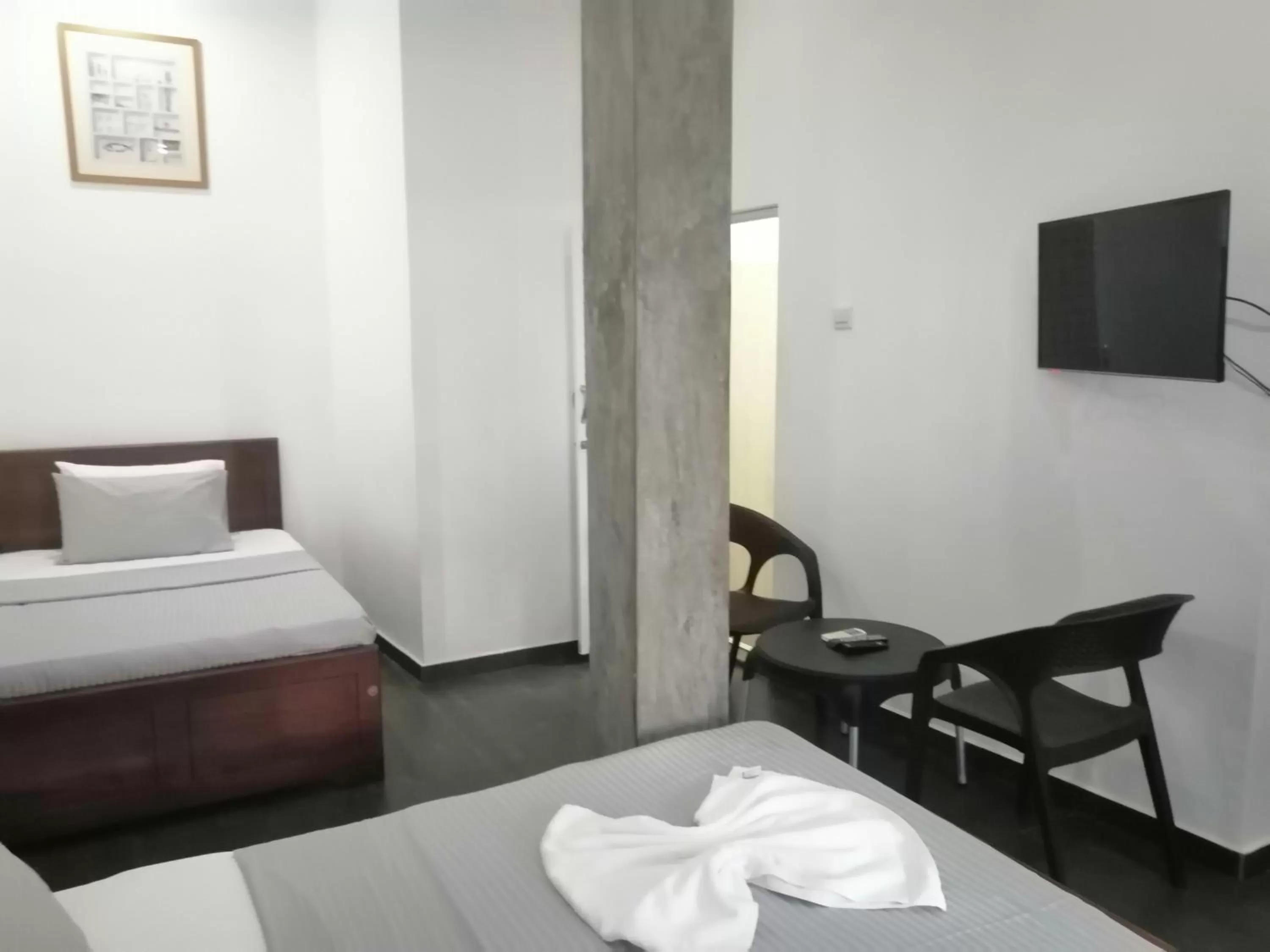 Bed in Le Petit Hotel & Restaurant