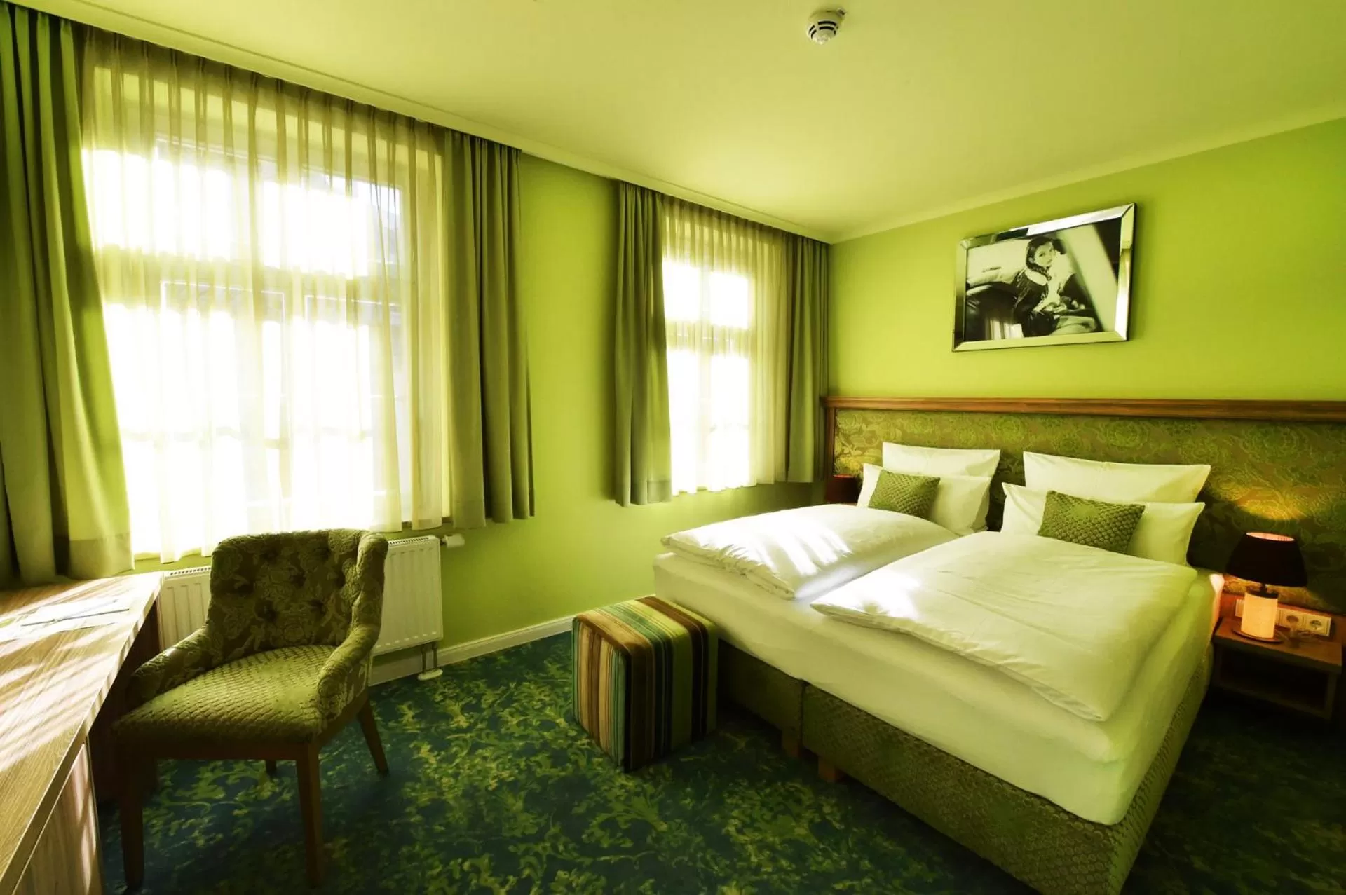 Photo of the whole room, Bed in MOMENTS Boutique Hotel