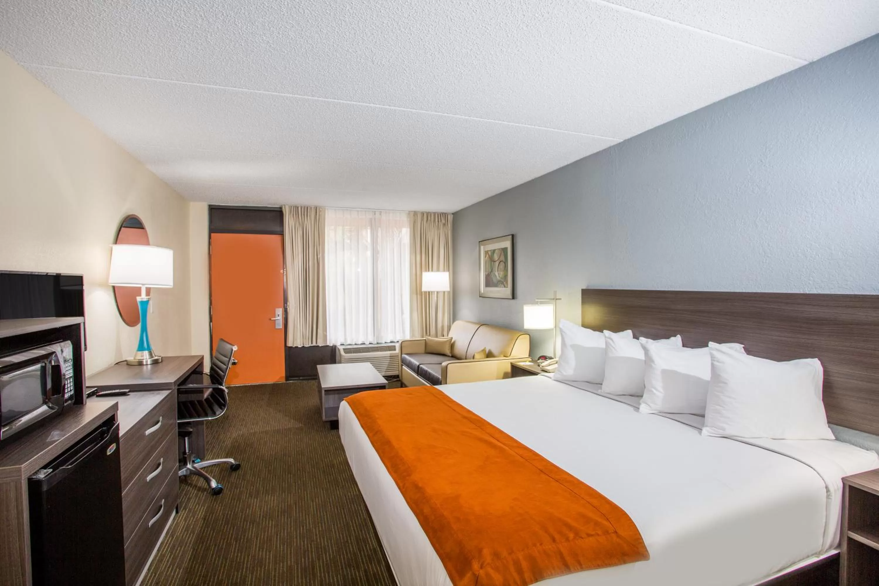 Photo of the whole room, Bed in Days Inn & Suites by Wyndham Orlando Airport