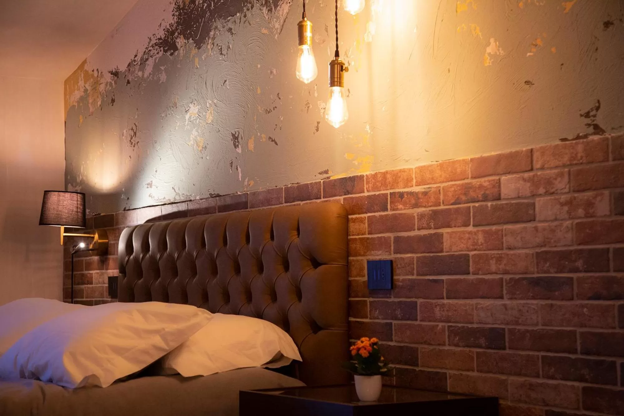 Bed in MANTRA Suite&Rooms