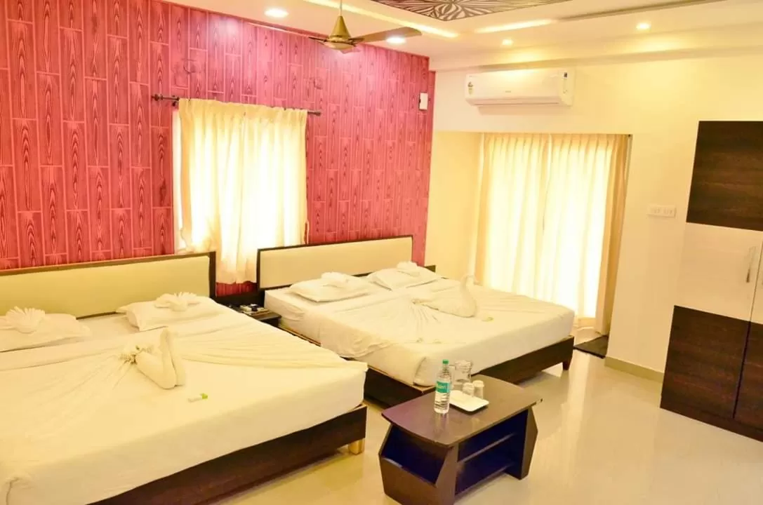 Bed in Hotel Ambai Grand