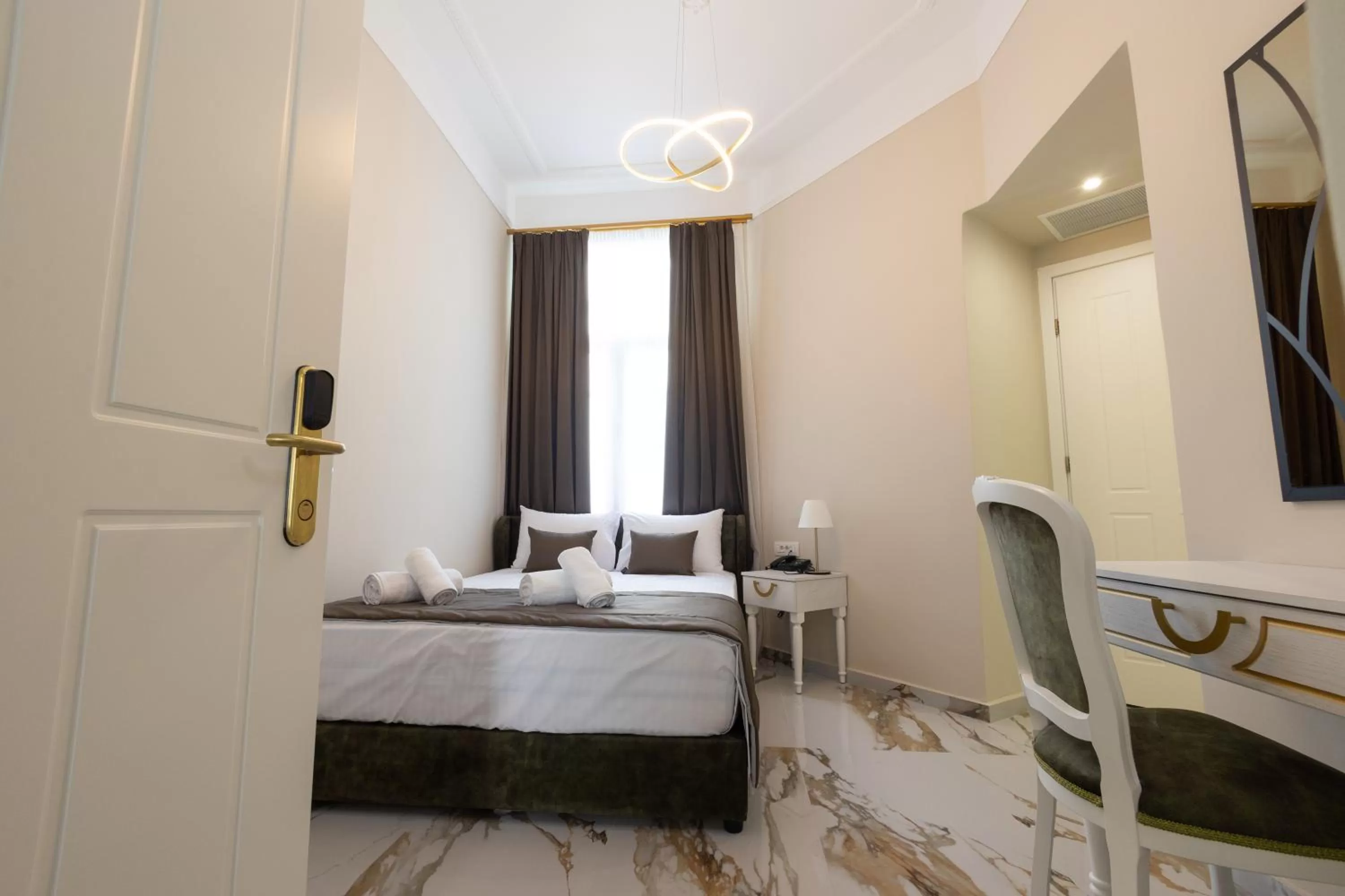 Bed in Modern Revival Luxury Hotel