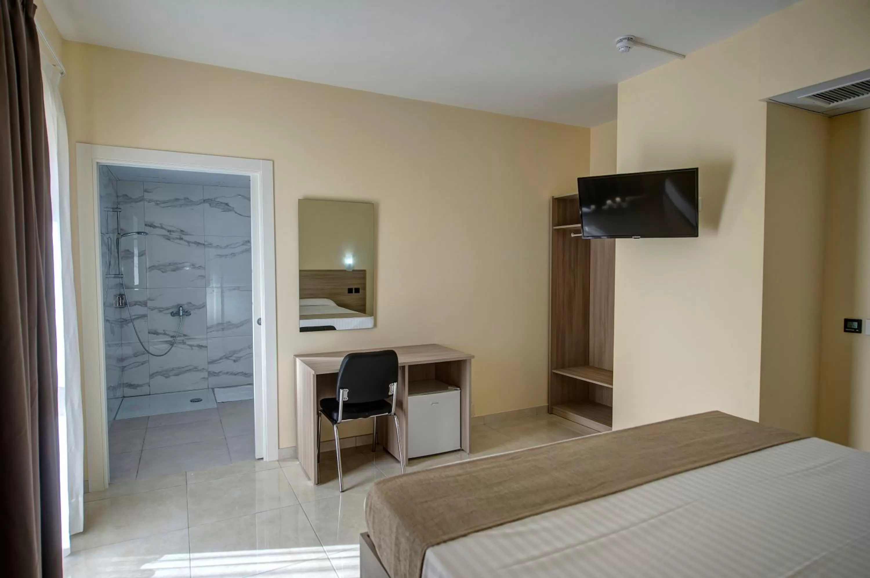 Bed in Allegro Hotel