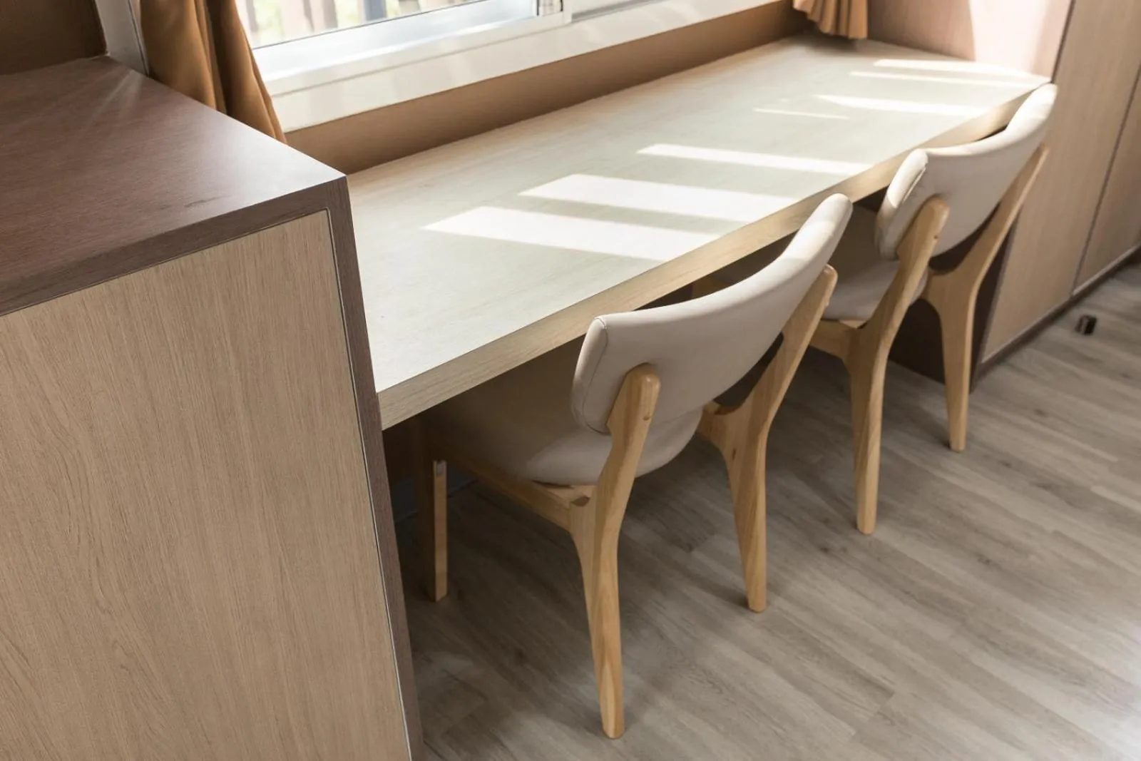 Seating area in Siam Stadium Hostel