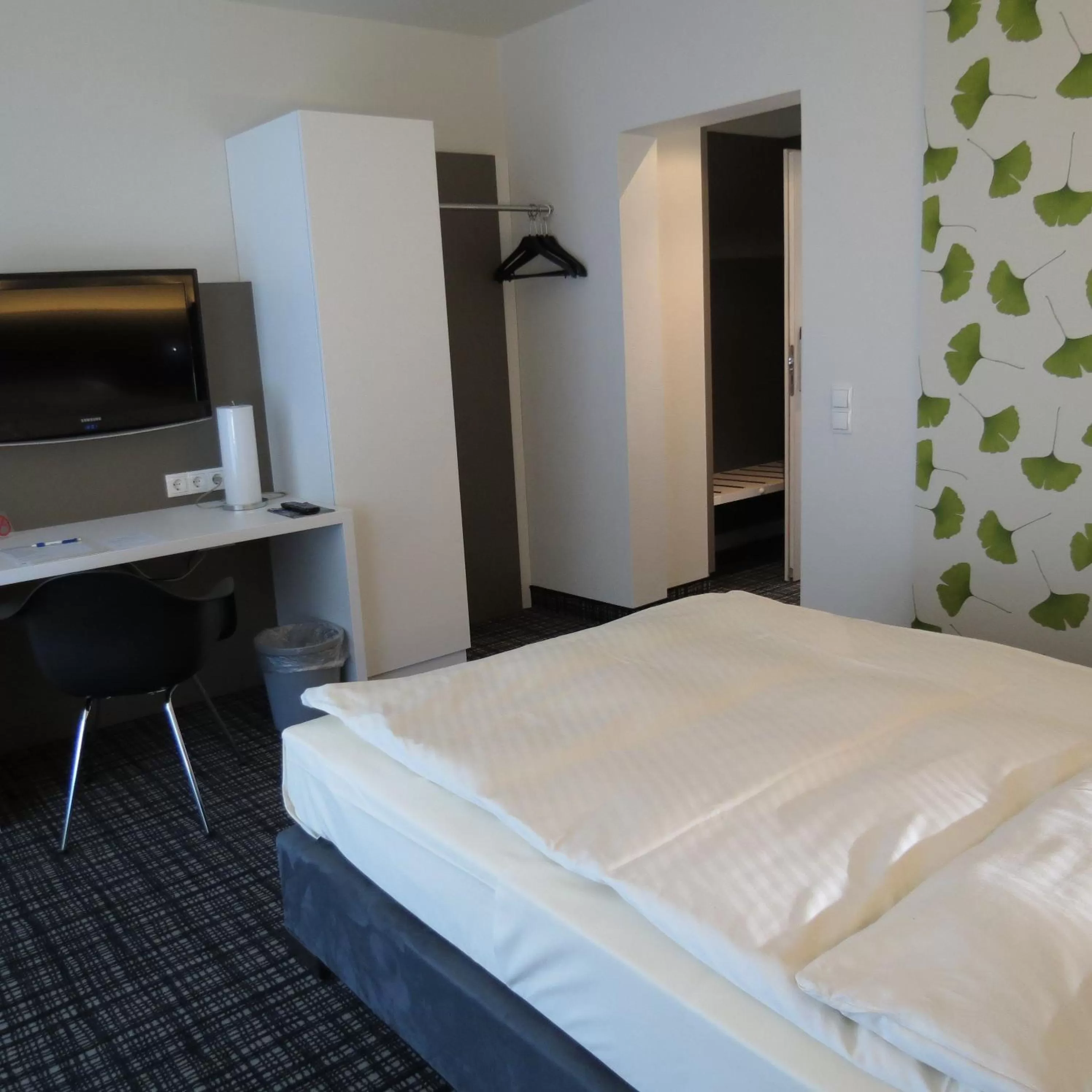 Photo of the whole room, Bed in Comfor Hotel Ulm City