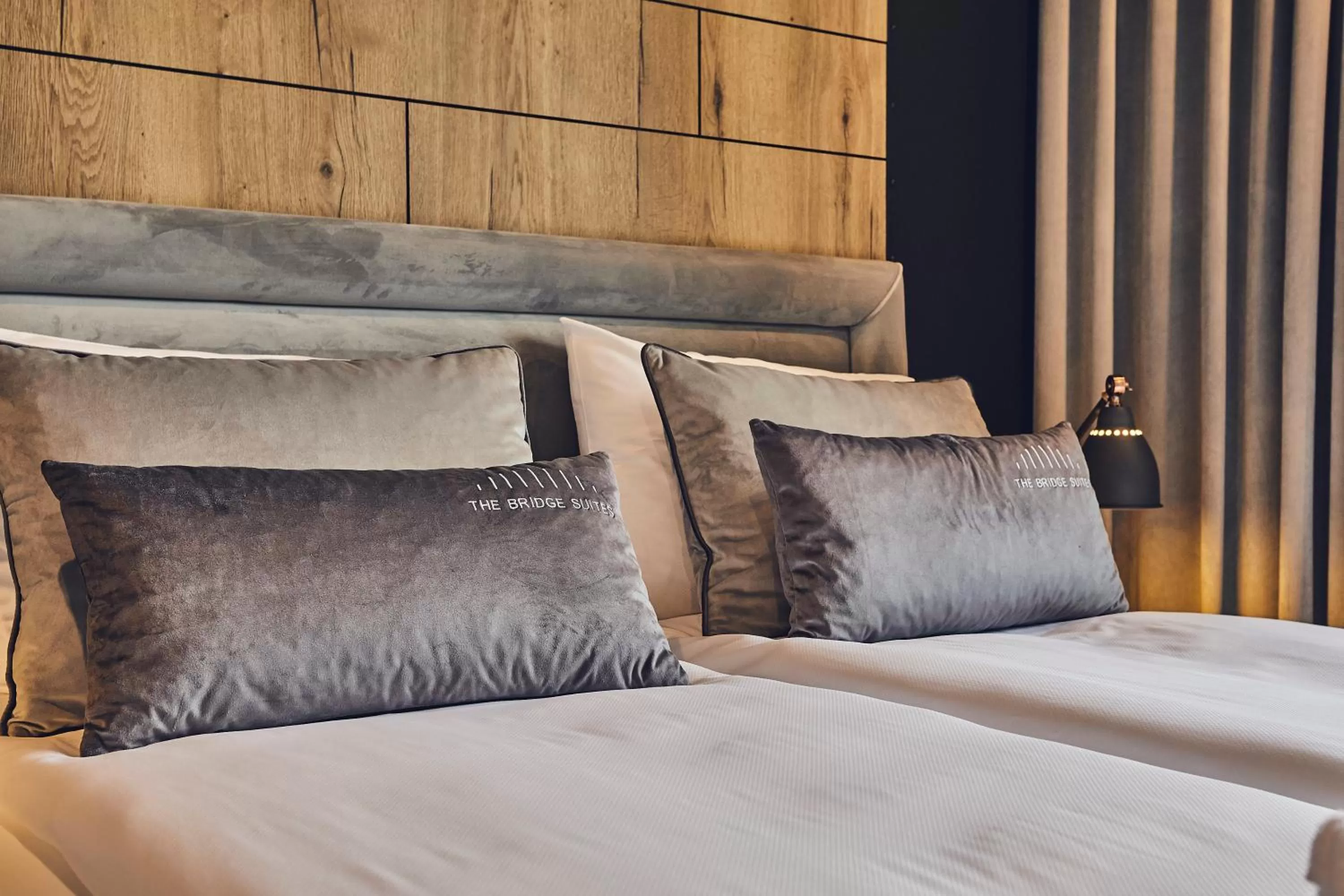 Bed in The Bridge Suites Hotel