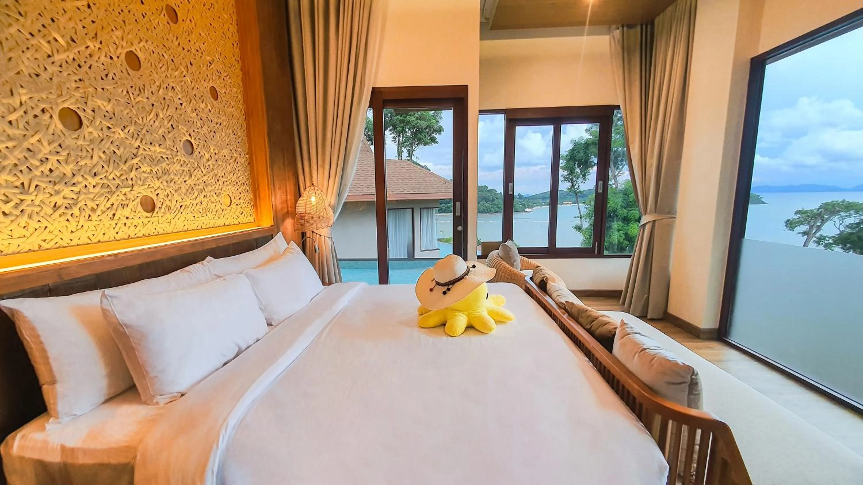 Bed in SINAE Phuket Luxury Hotel