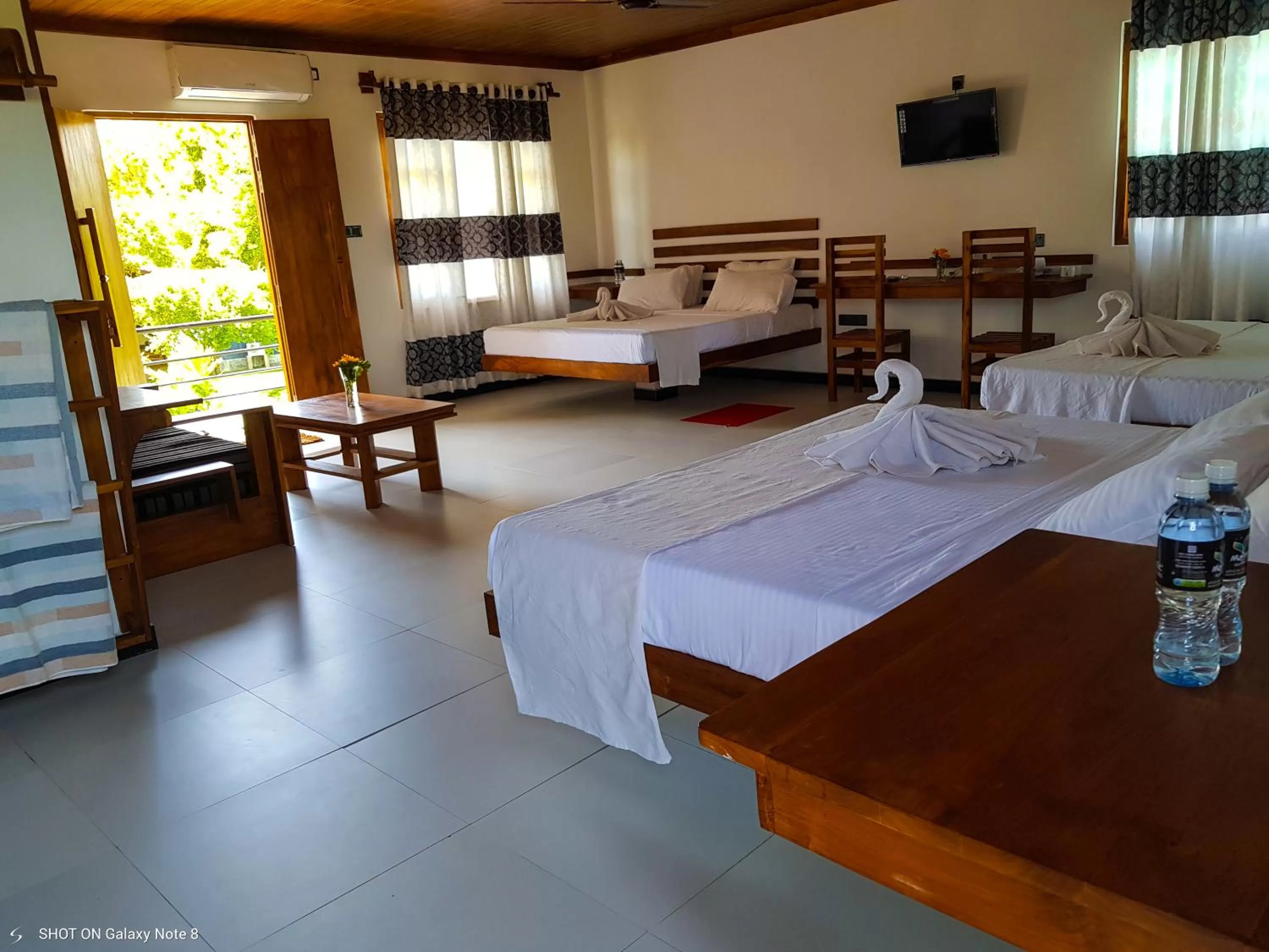 Living room, Bed in Eco Hotel Black & White - Anuradhapura