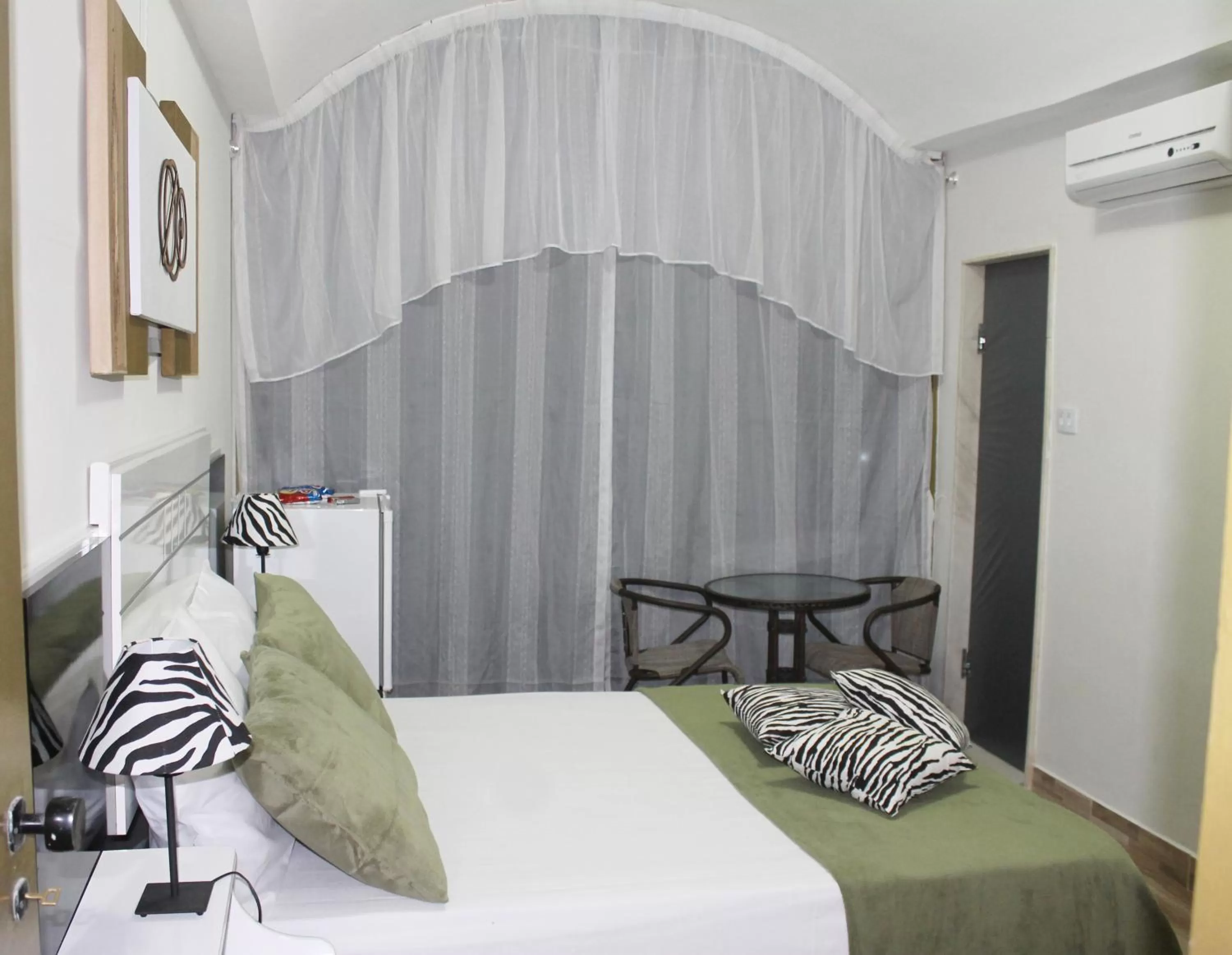 Bed in Pousada Das Palmeiras