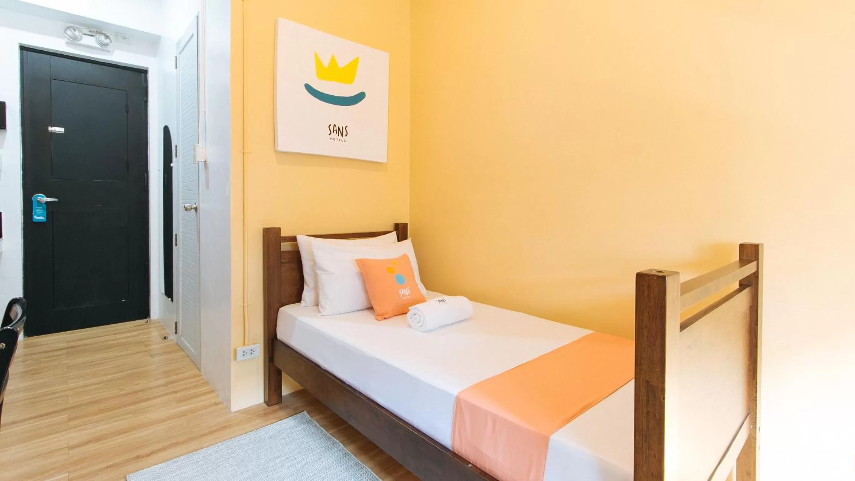 Bed in Sans Hotel Laperal Manila