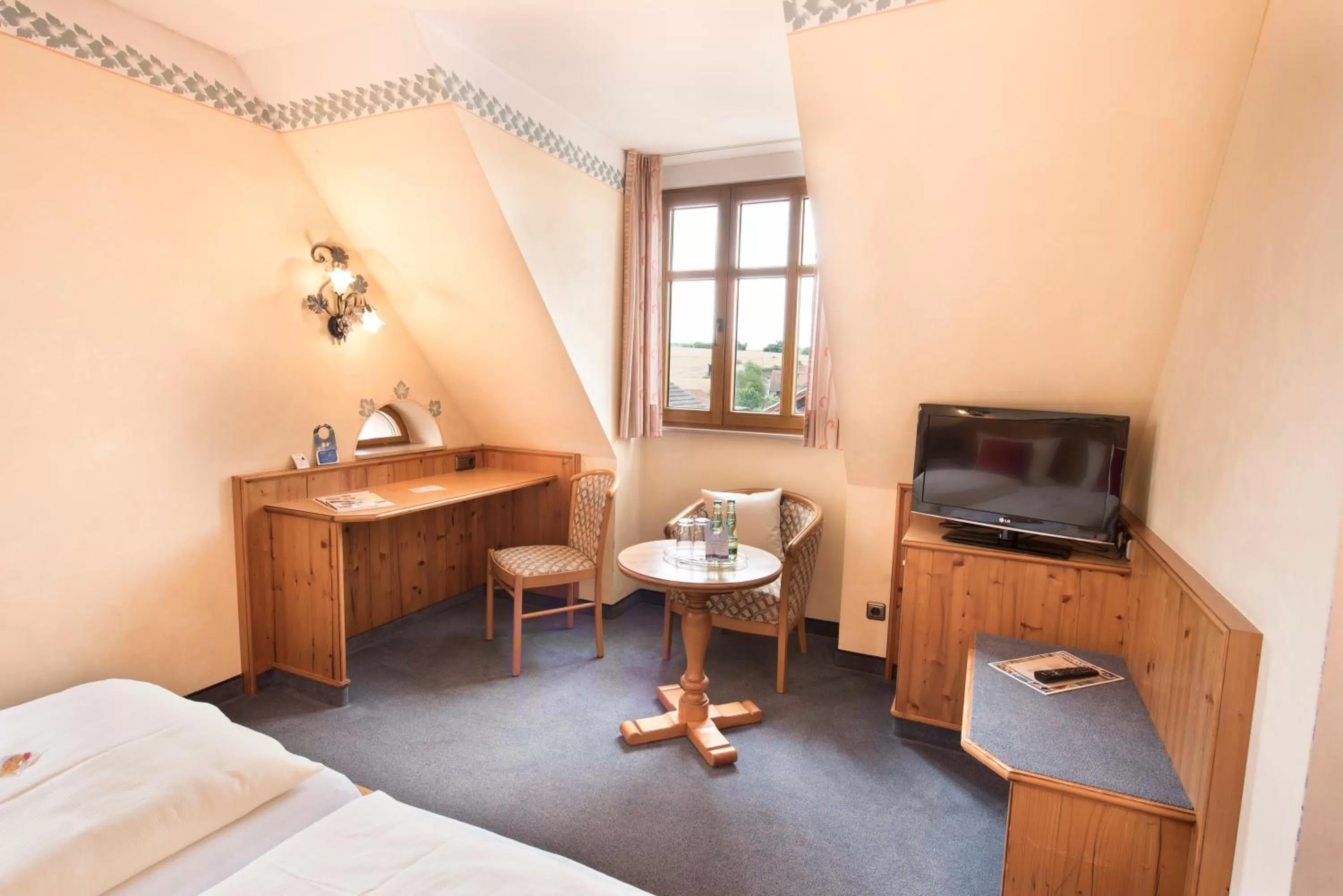 Seating area, Bed in AKZENT Hotel Krone