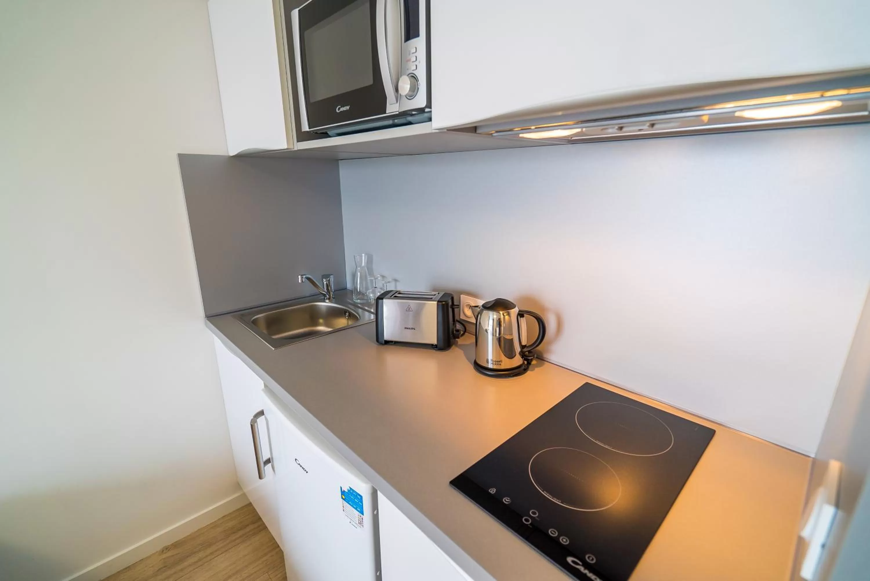Kitchen or kitchenette in All Suites Appart Hôtel - Choisy-le-Roi