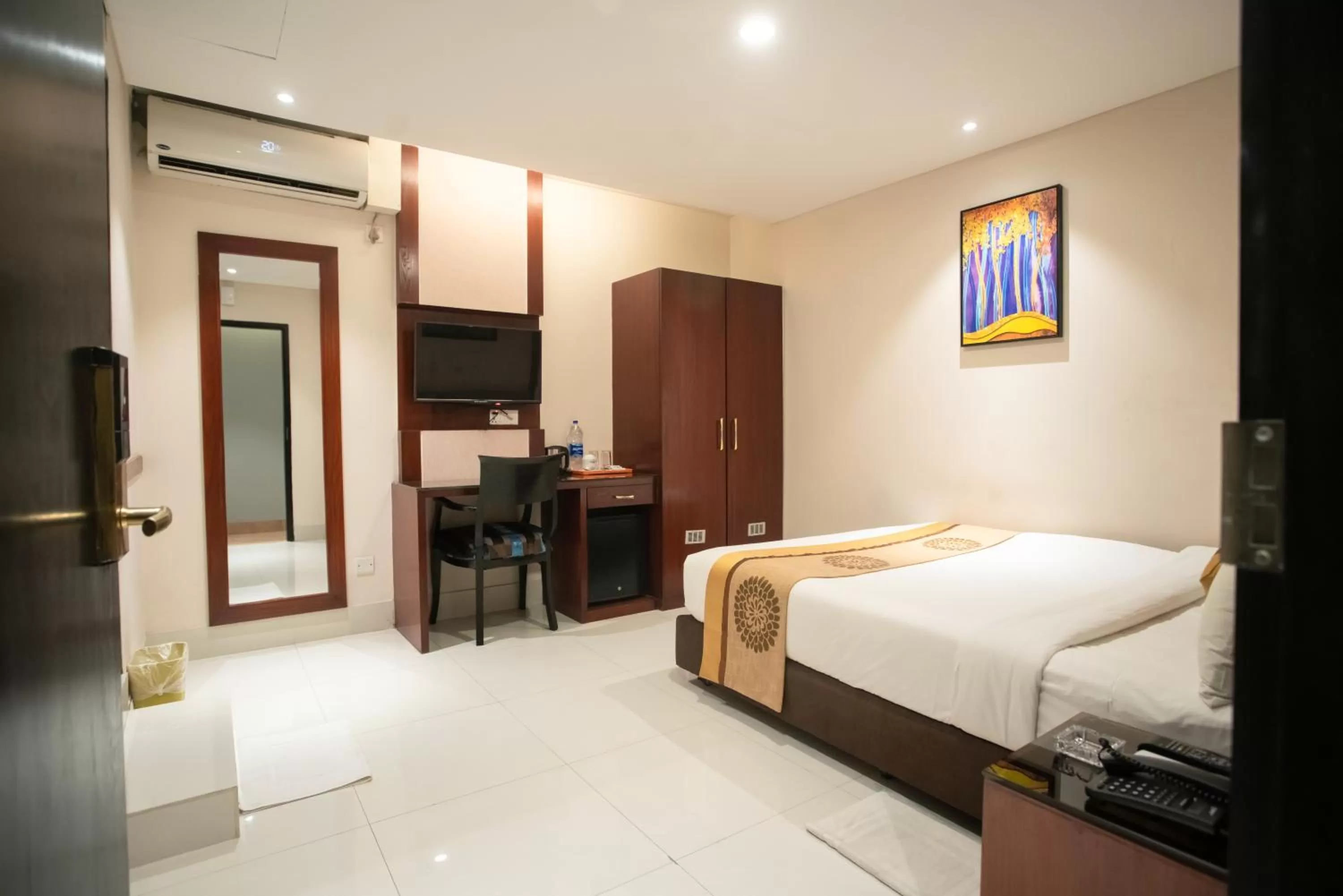 Bed in Jatra Hotel Grand Royal