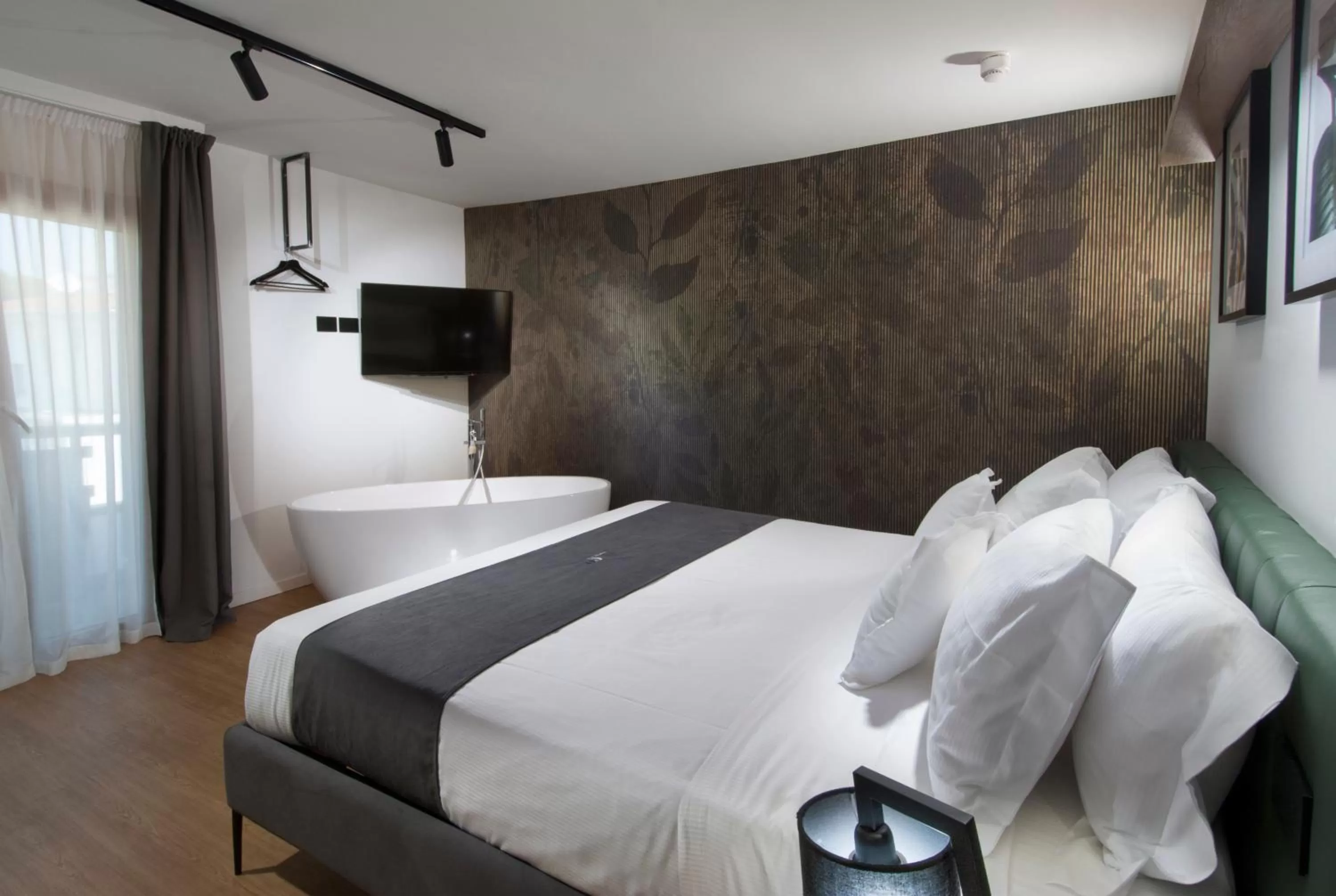 Bed in Meg Lifestyle Hotel & Apartaments