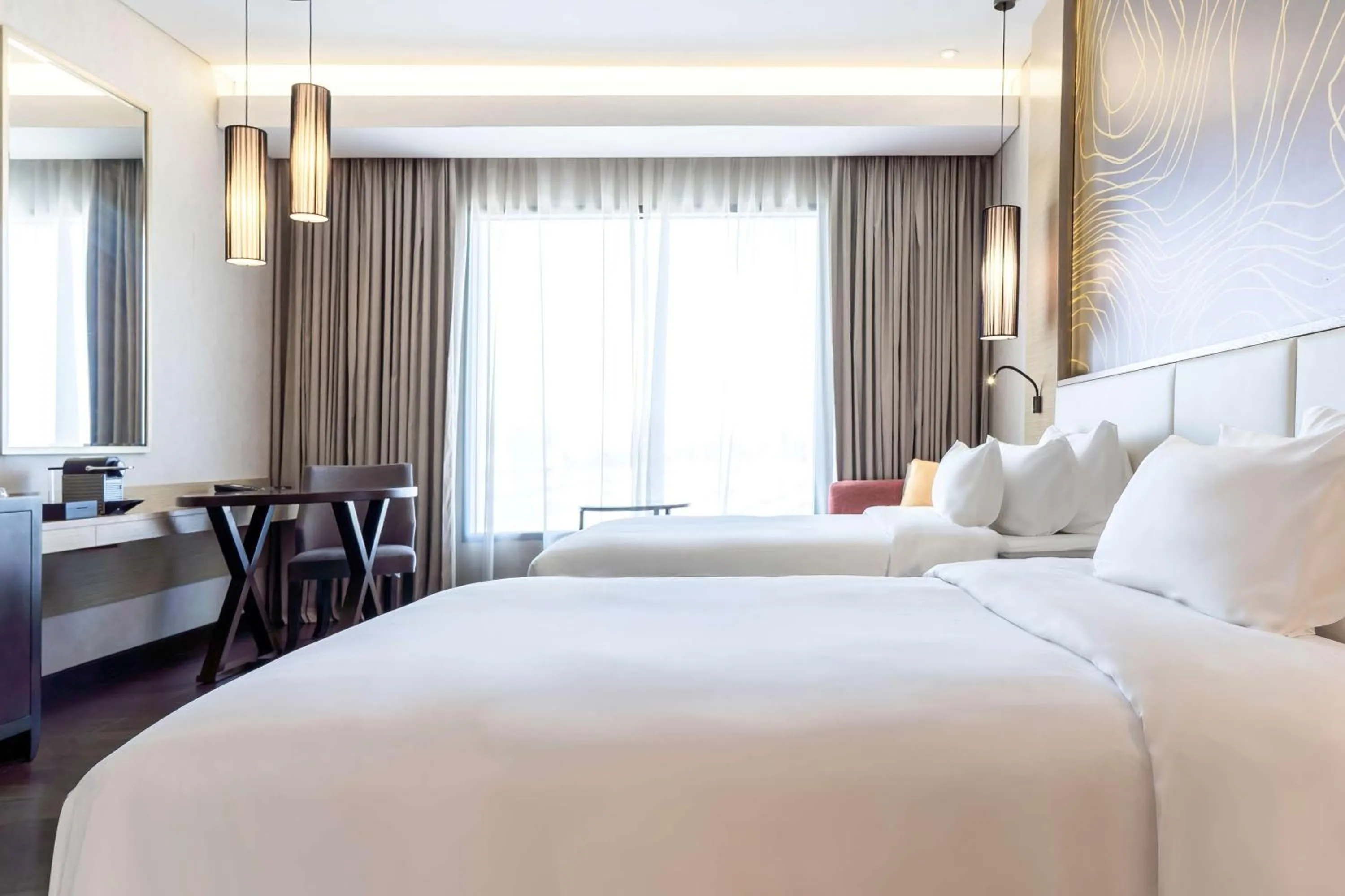 Bed in Radisson Collection Muscat, Hormuz Grand