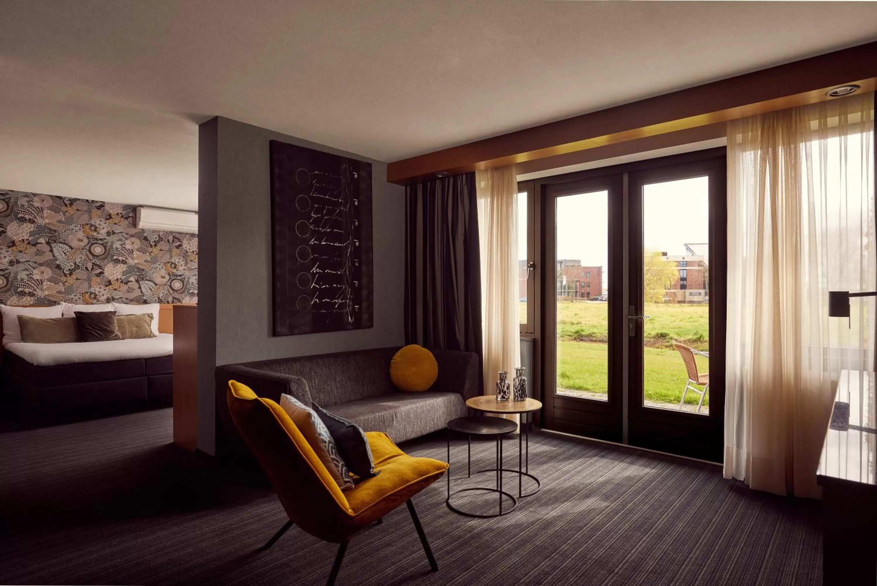 Seating area, Bed in Van der Valk Drachten