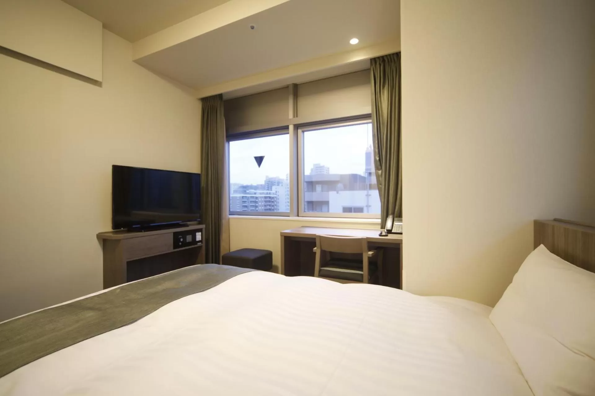 Bed in Dormy Inn Korakuen