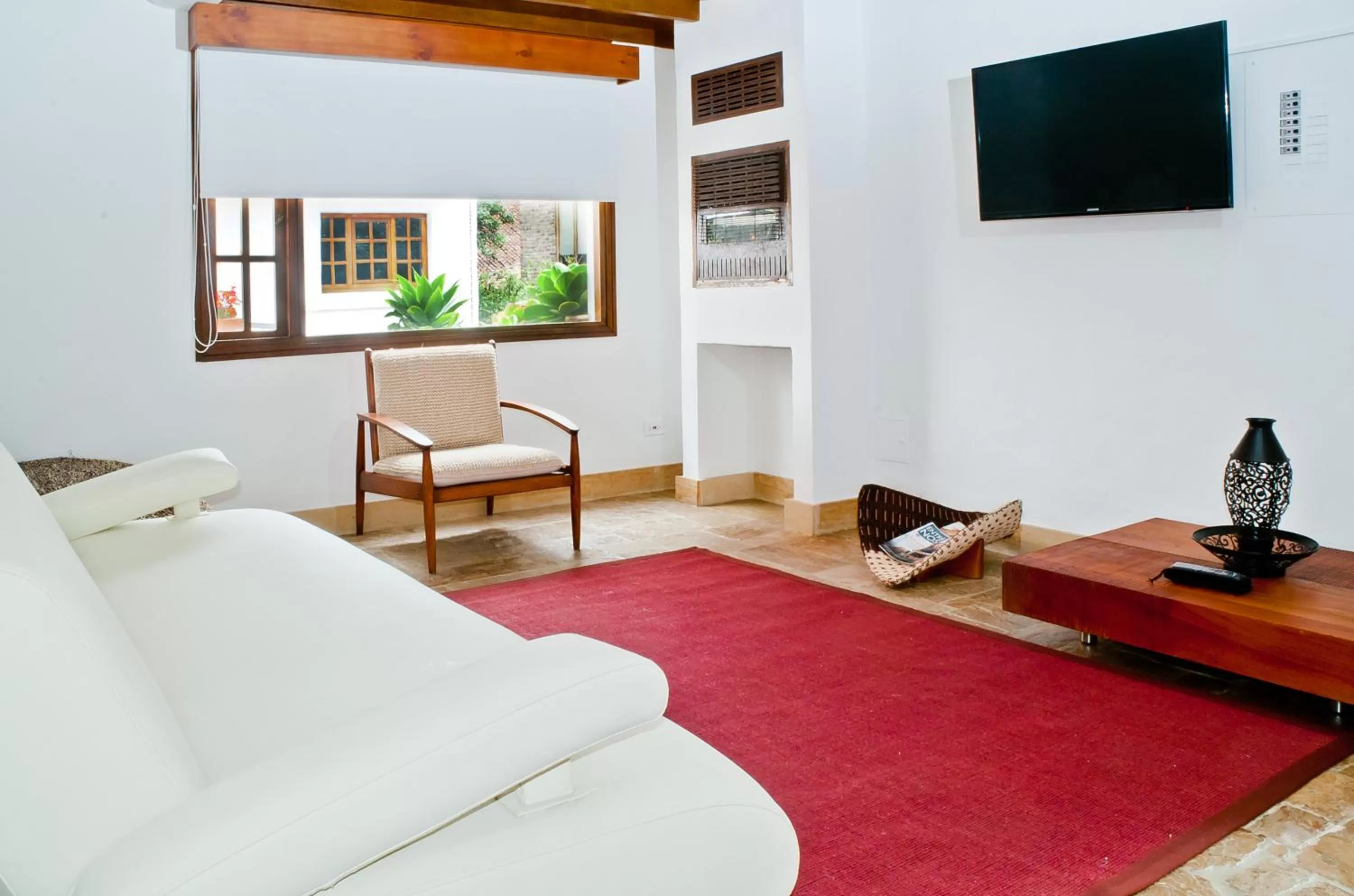 Communal lounge/ TV room, Bed in Hotel Casona Usaquen