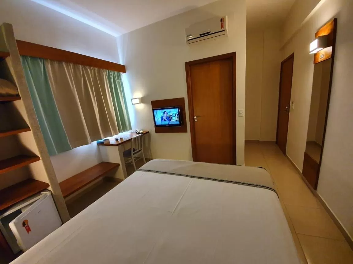 Bed in Meu Hotel Garça