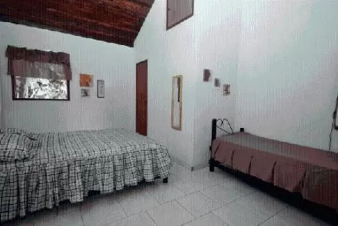 Bed in Pousada A Marca do Faraó