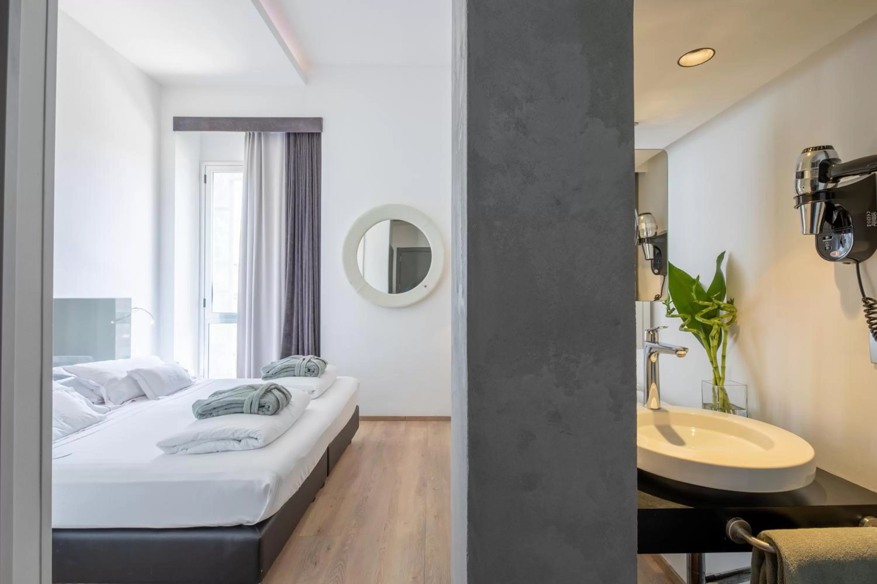 Bed in UNA HOTELS One Siracusa