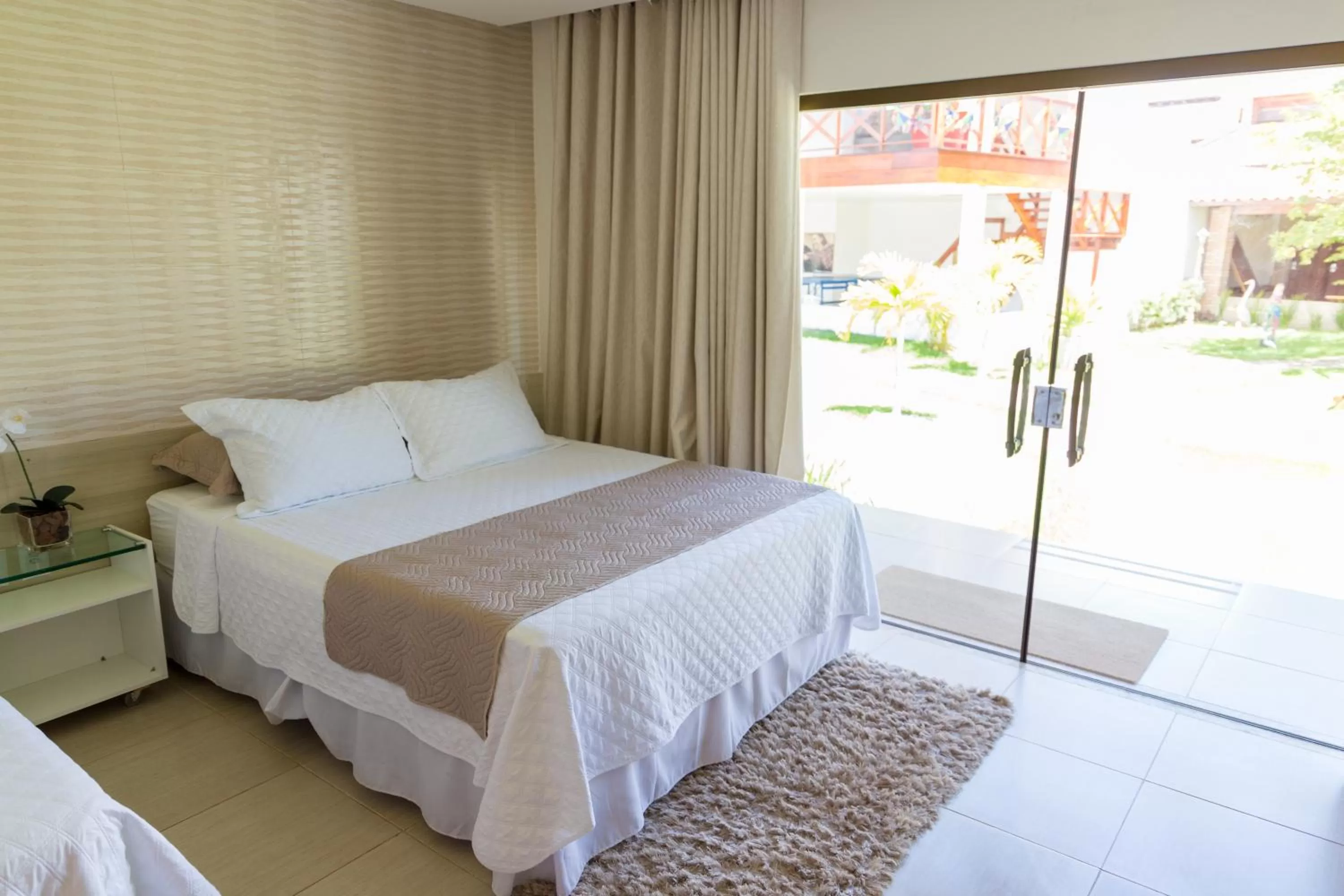 Bed in Pousada Sol e Mar