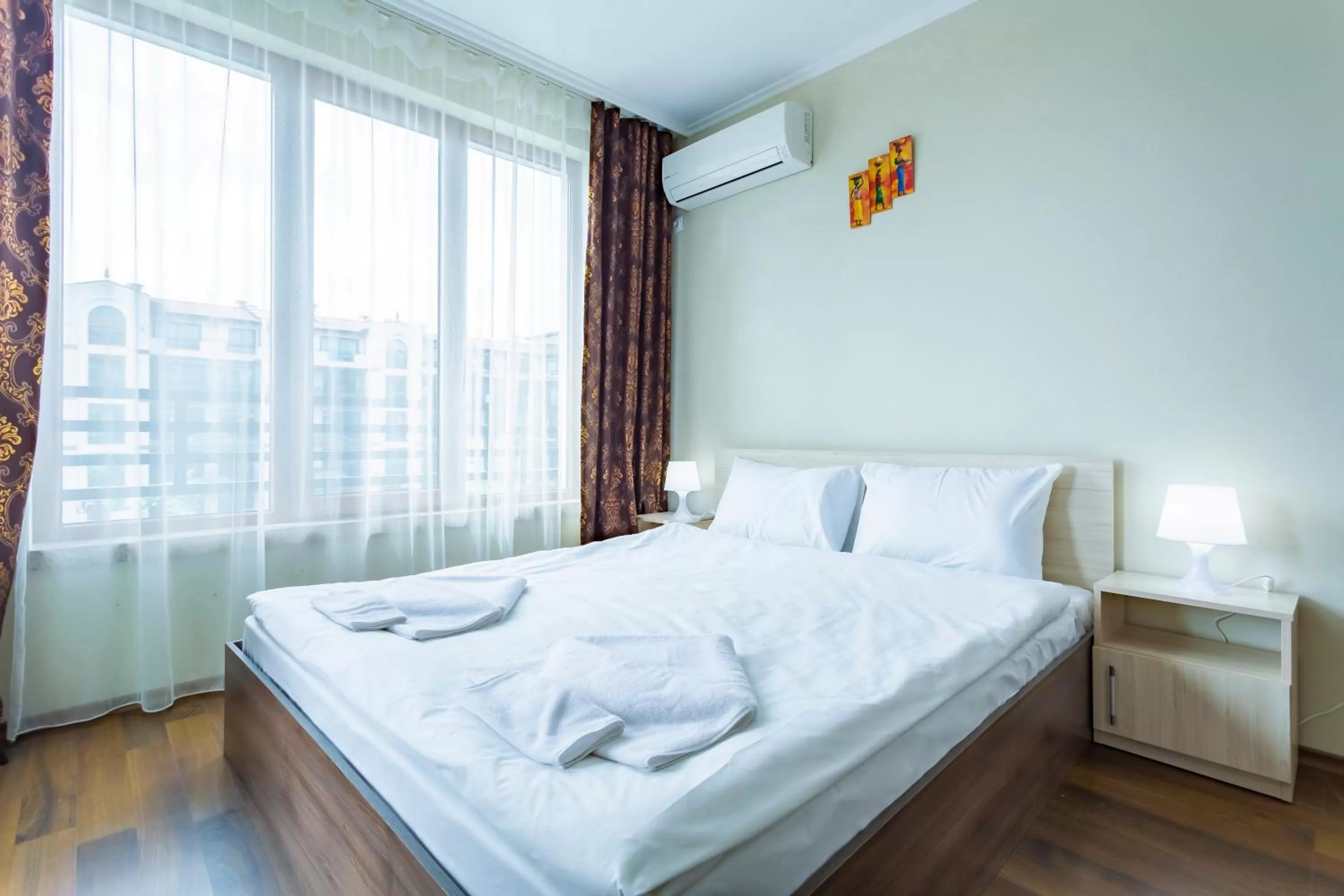 Bed in Rose Gardens Apart Hotel