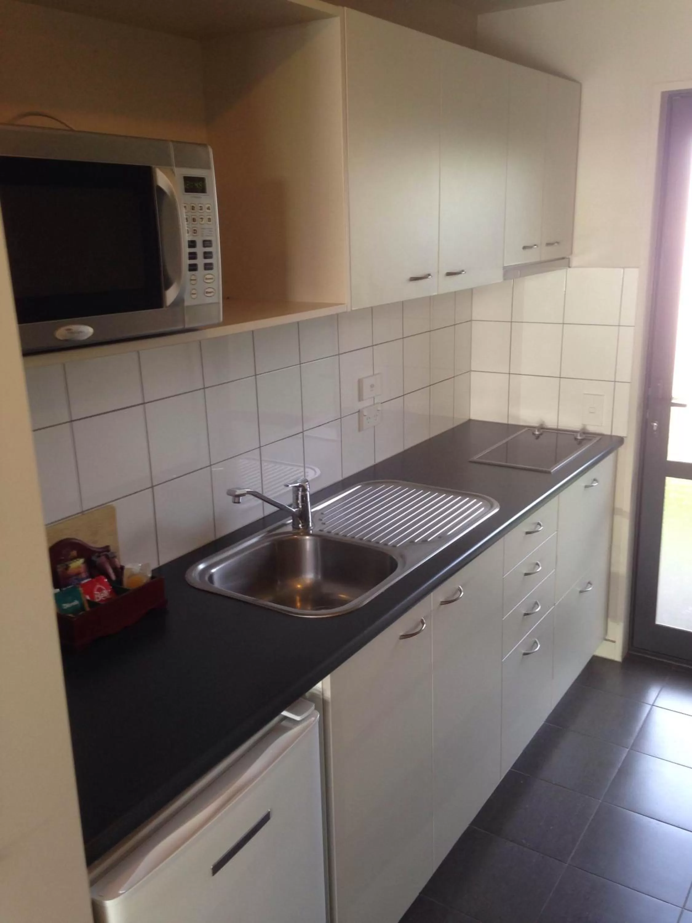 Kitchen or kitchenette in Azena Suites & Apartment