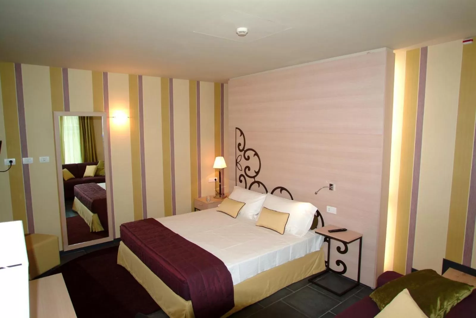 Bed in El Homs Palace Hotel