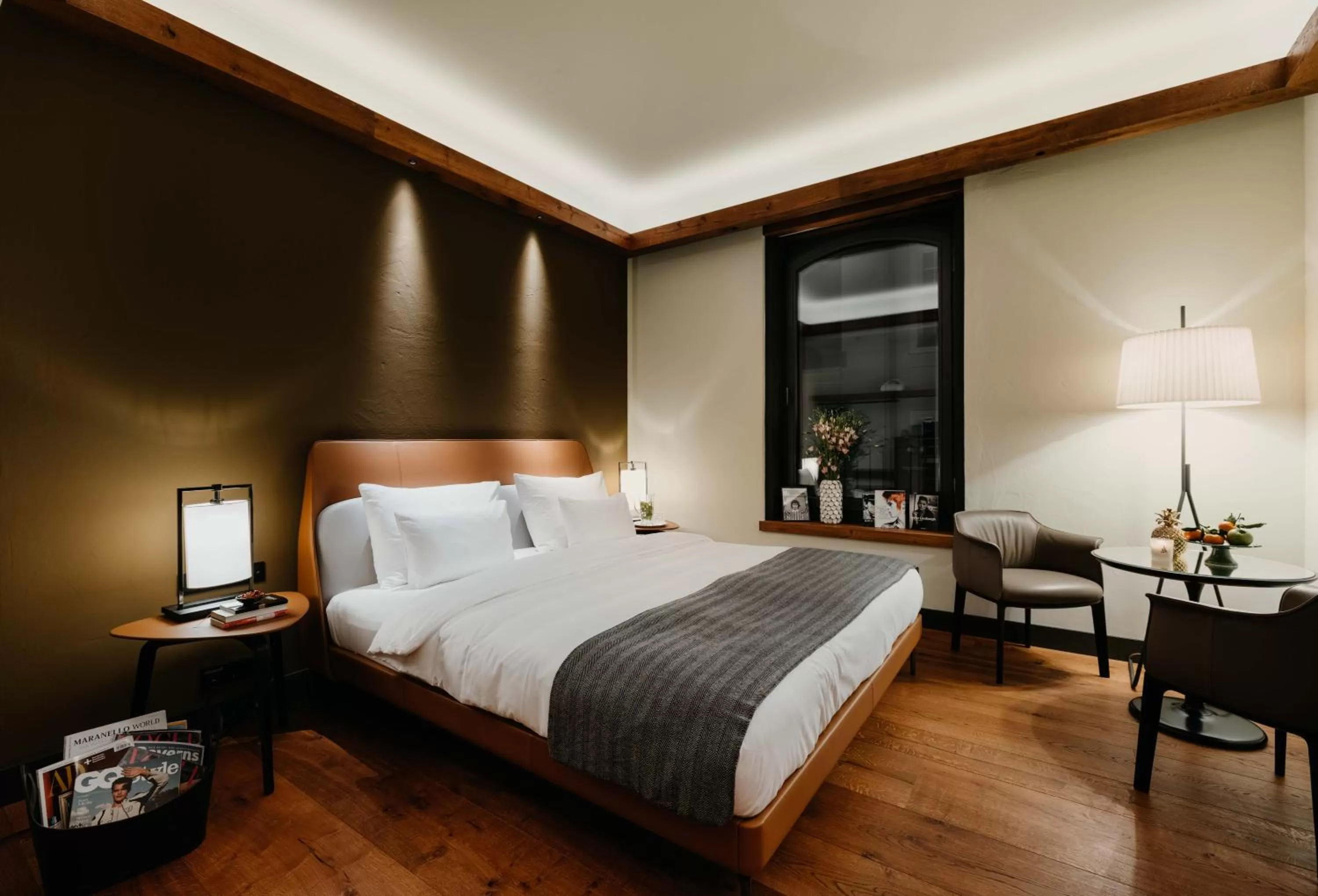 Living room, Bed in DO & CO Hotel München