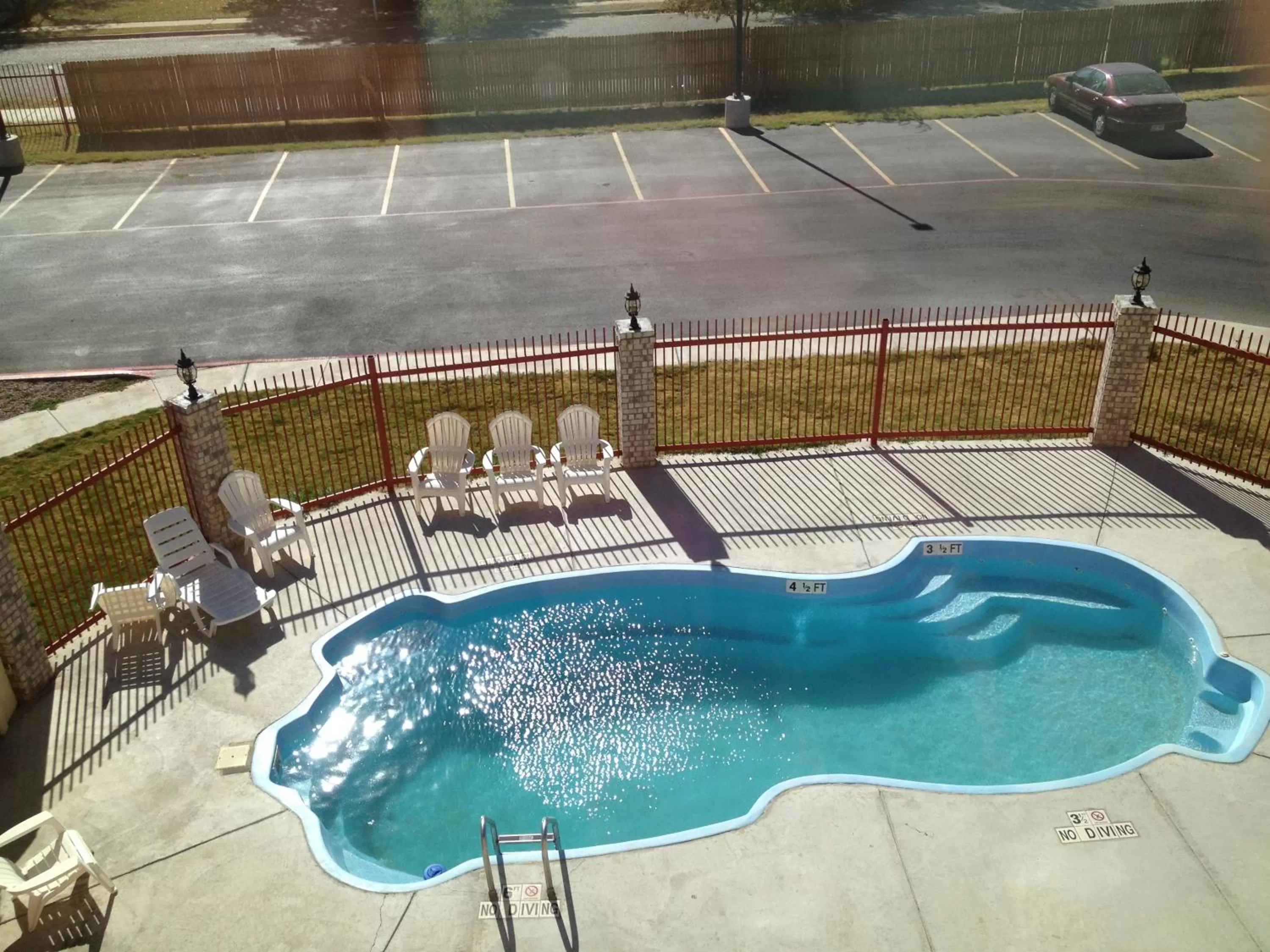 Swimming pool in Howard Johnson by Wyndham Lubbock TX