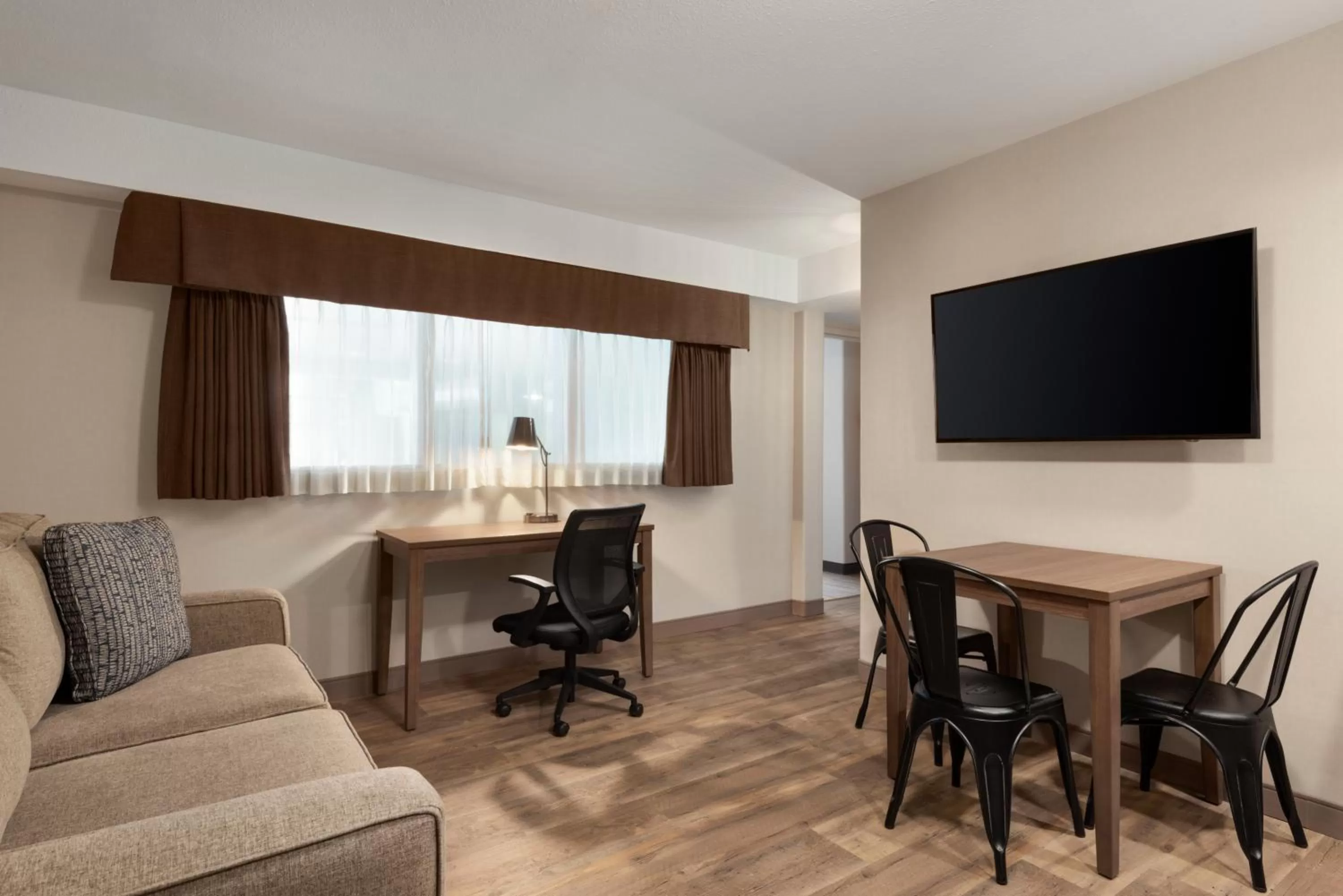 Seating area in Ramada by Wyndham Airdrie Hotel & Suites