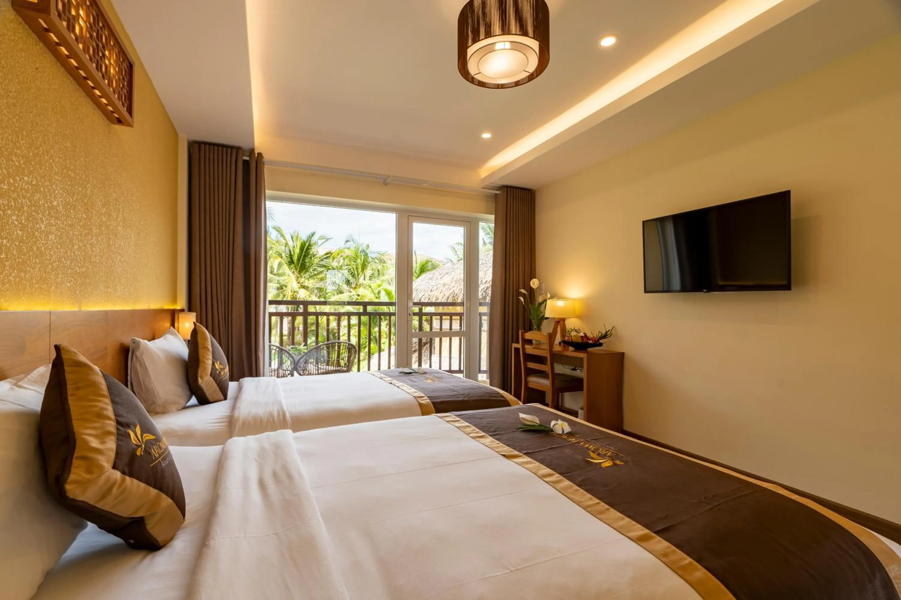 Bed in Aroma Beach Resort and Spa
