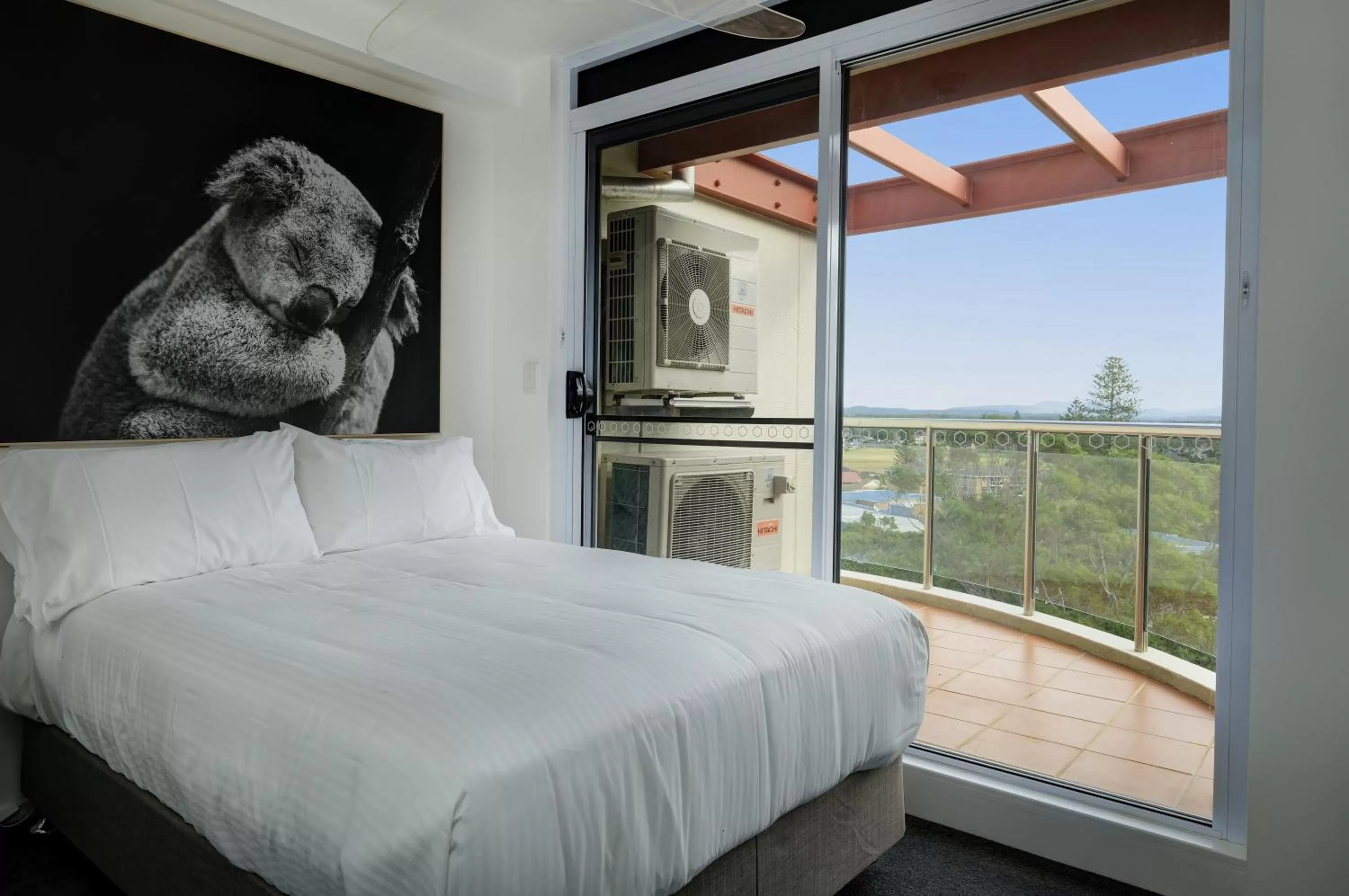 Bed in Sunrise Luxury Apartments