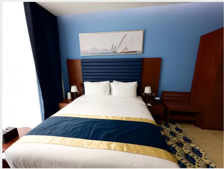 Bed in BANIYAS PLAZA HOTEL APARTMENTS