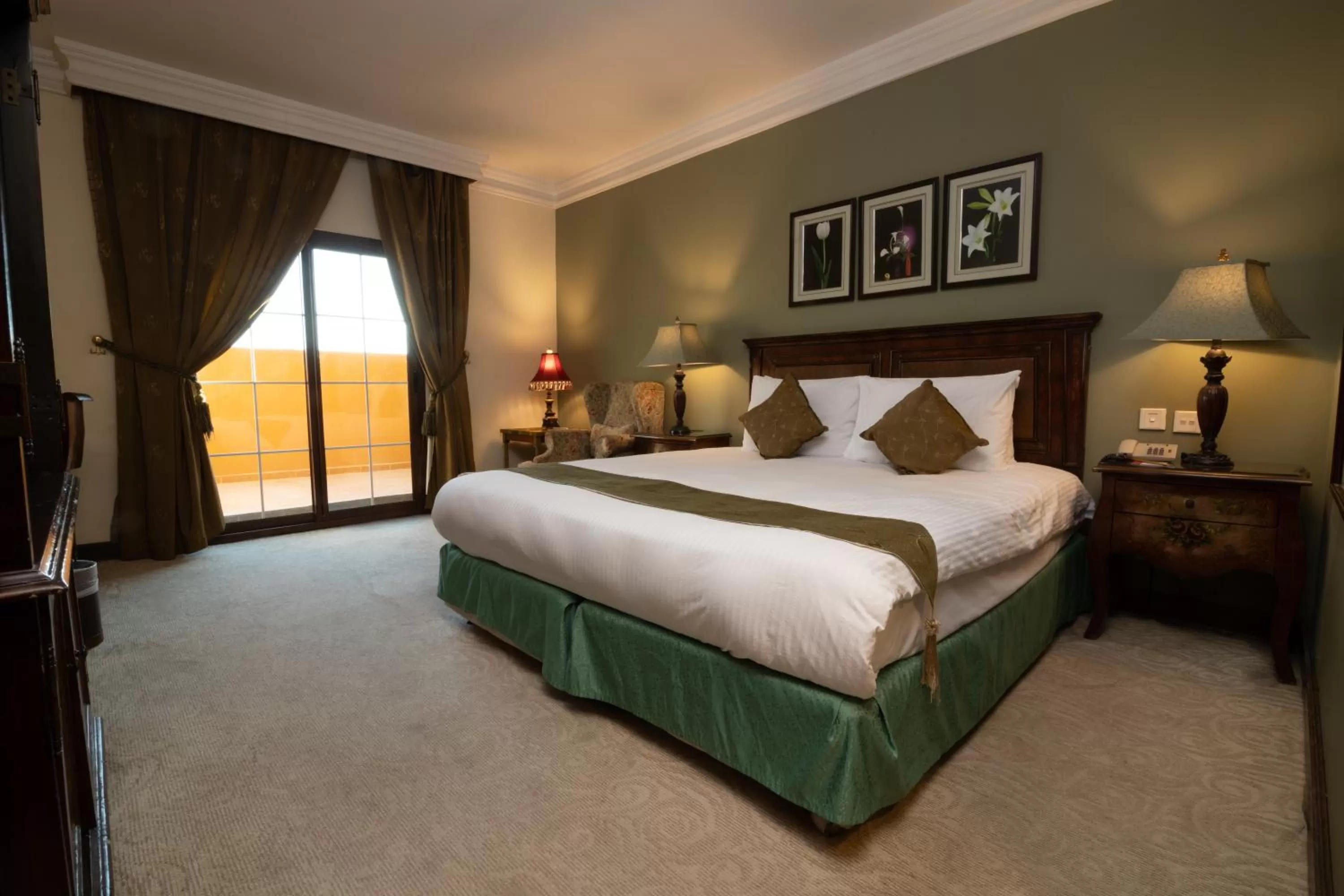 Bed in The Convention Center & Royal Suites Hotel