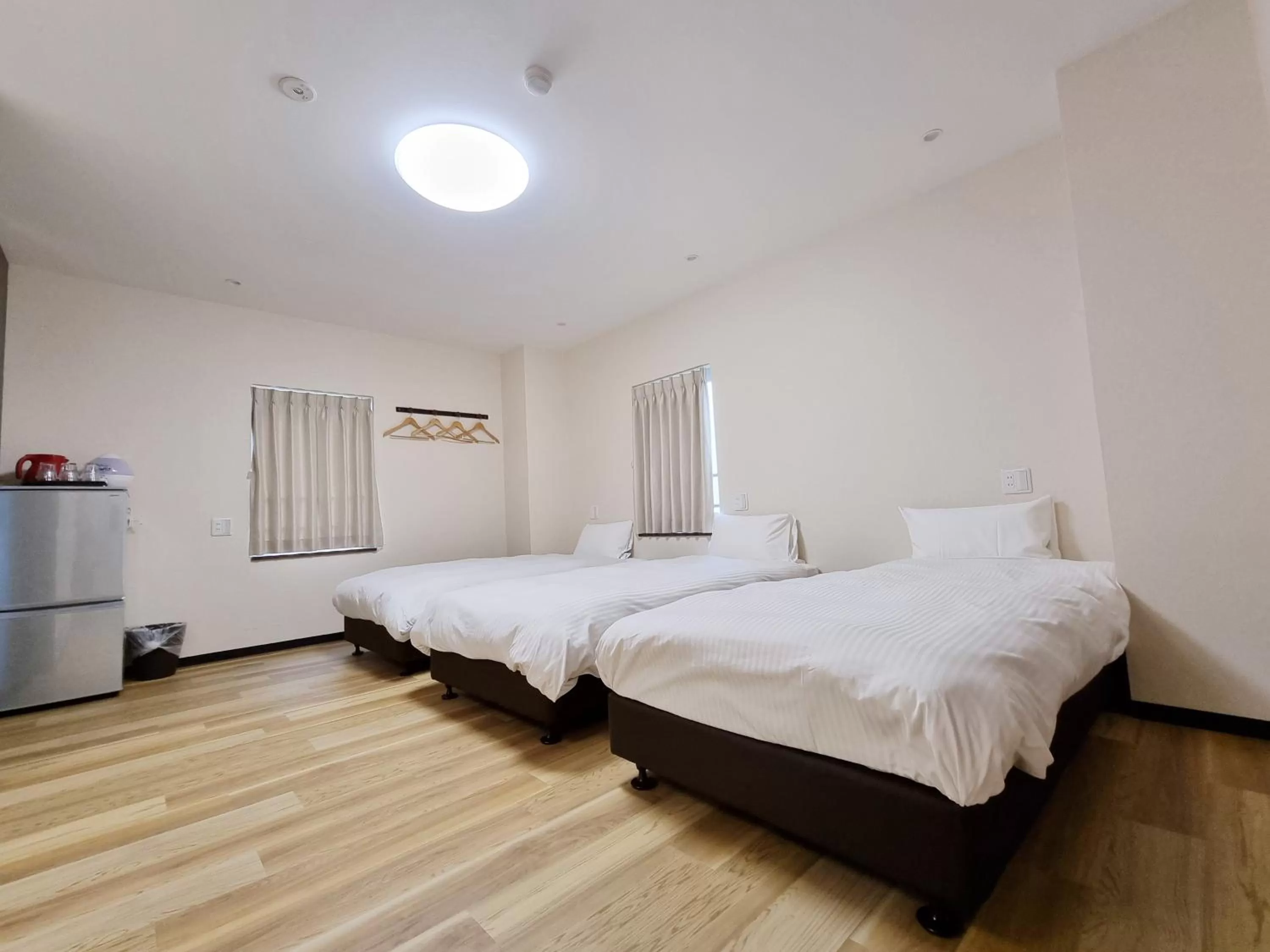 Bed in KYU KYU HOTEL