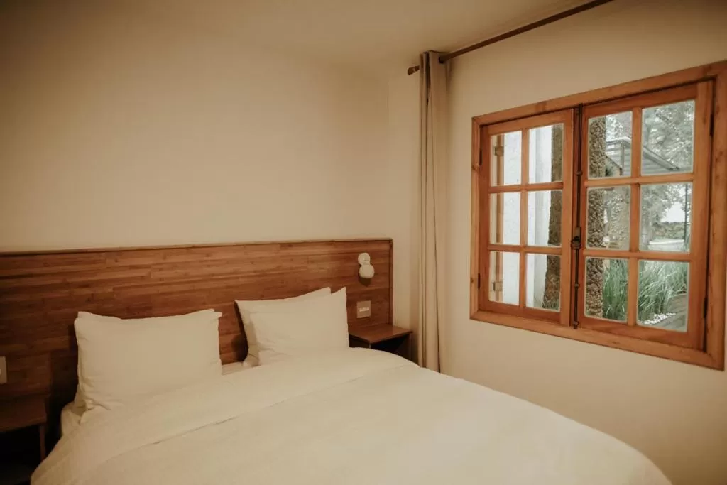 Bed in La Brume Pousada