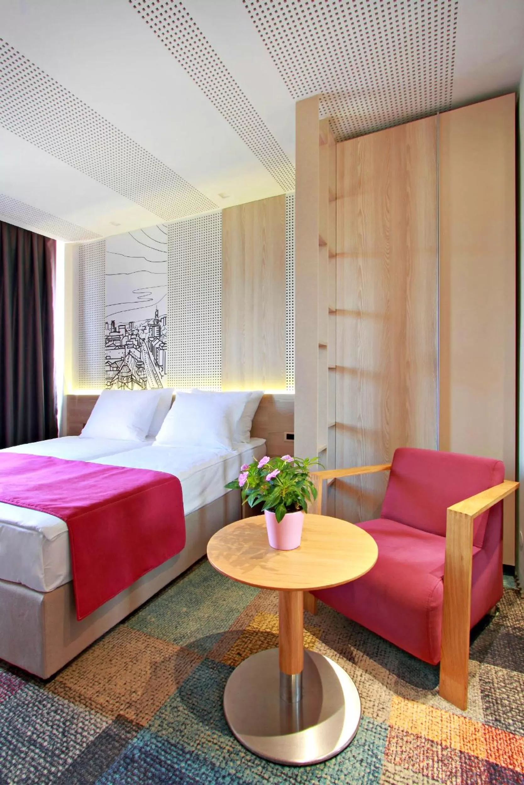Seating area, Bed in Hotel Cosmopolit
