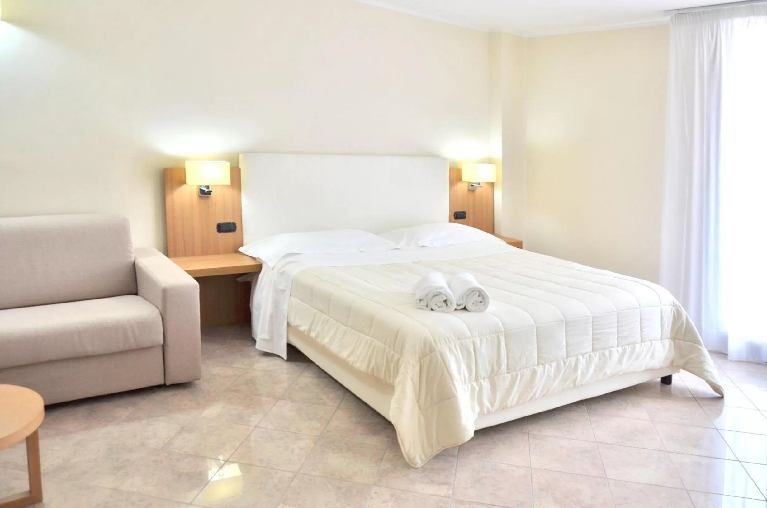 Bed in Vea Resort Hotel