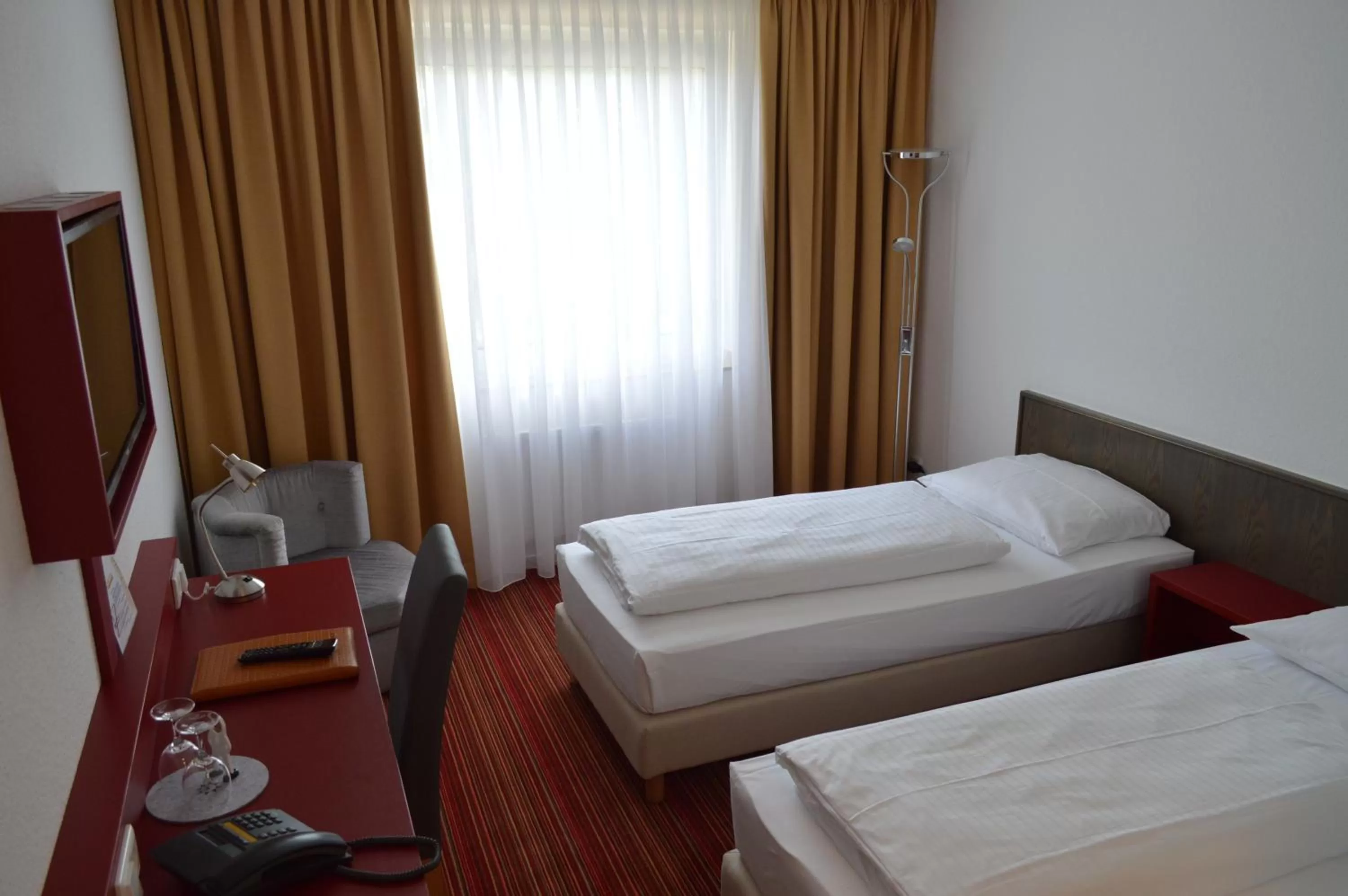 Toilet, Bed in Hotel Astra